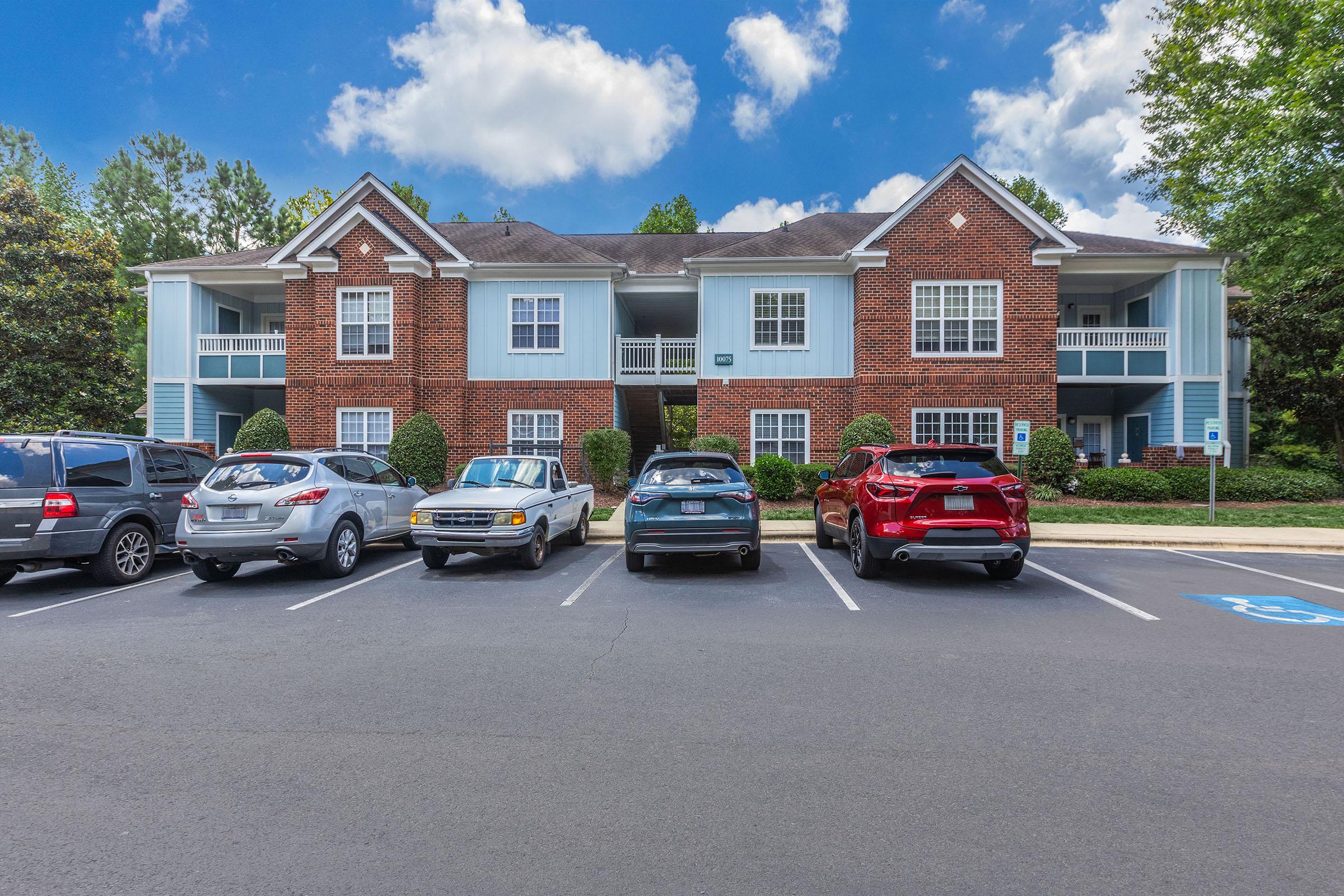 a car parked on a street in front of a house