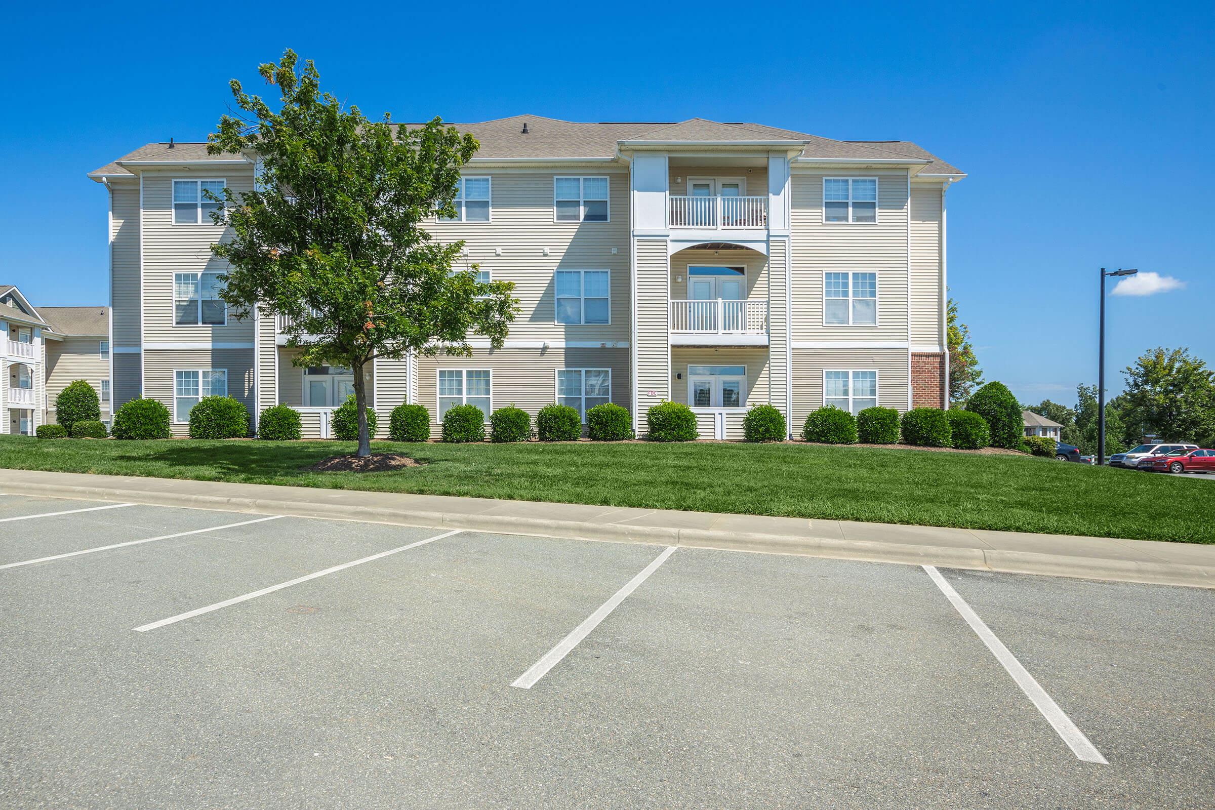 an empty parking lot in front of a building