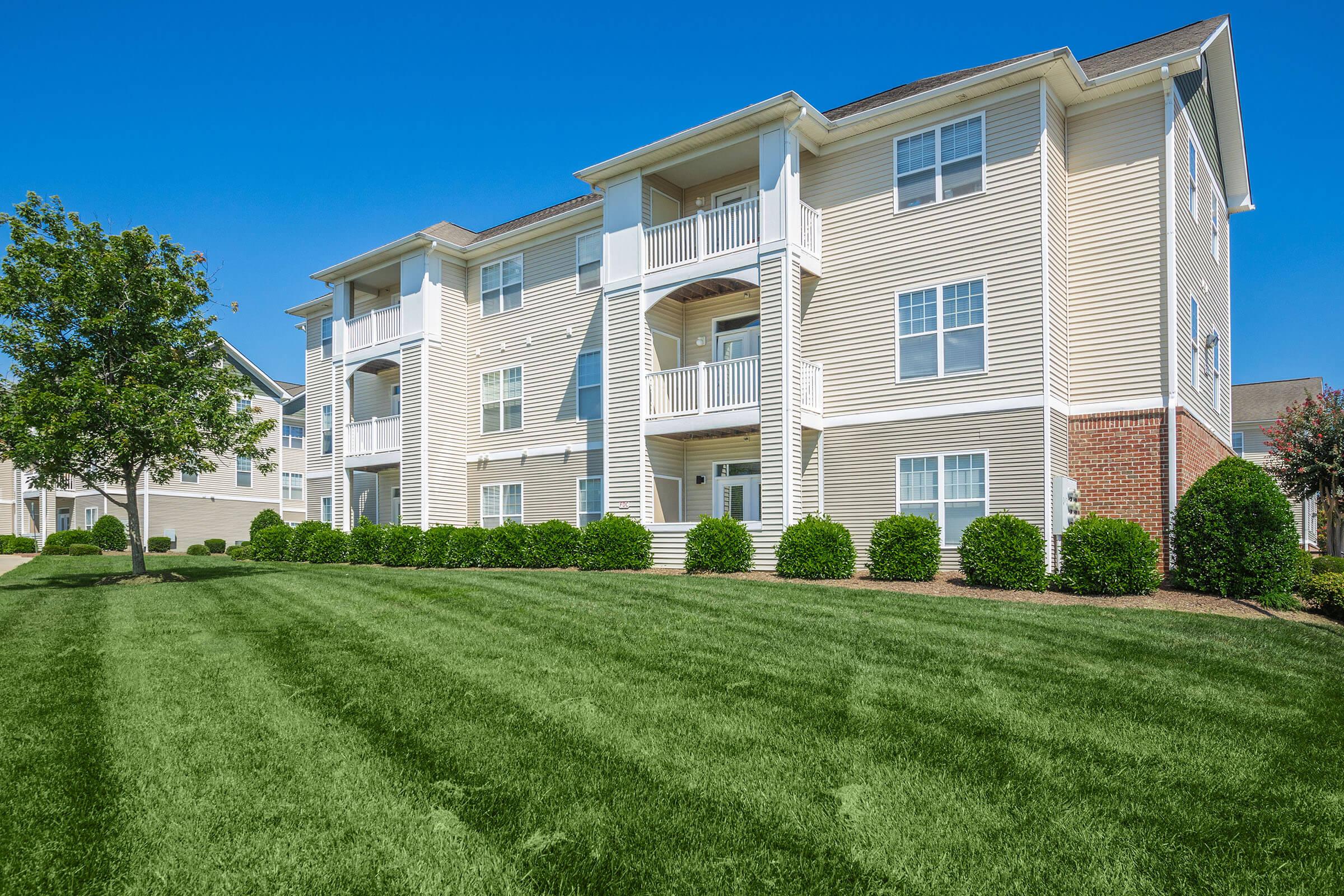 a large lawn in front of a building