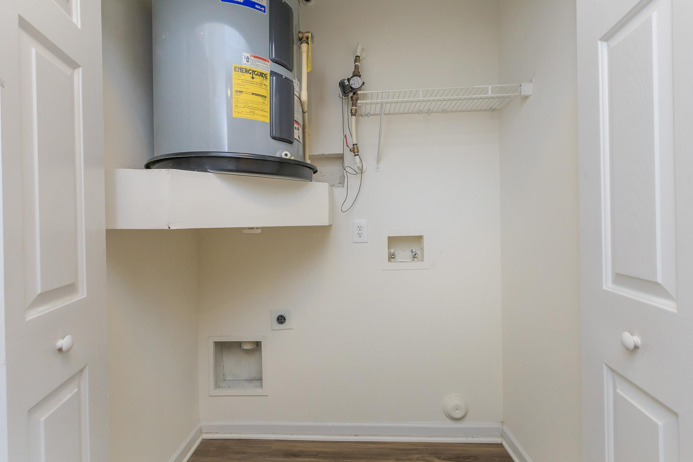 a white sink sitting next to a door