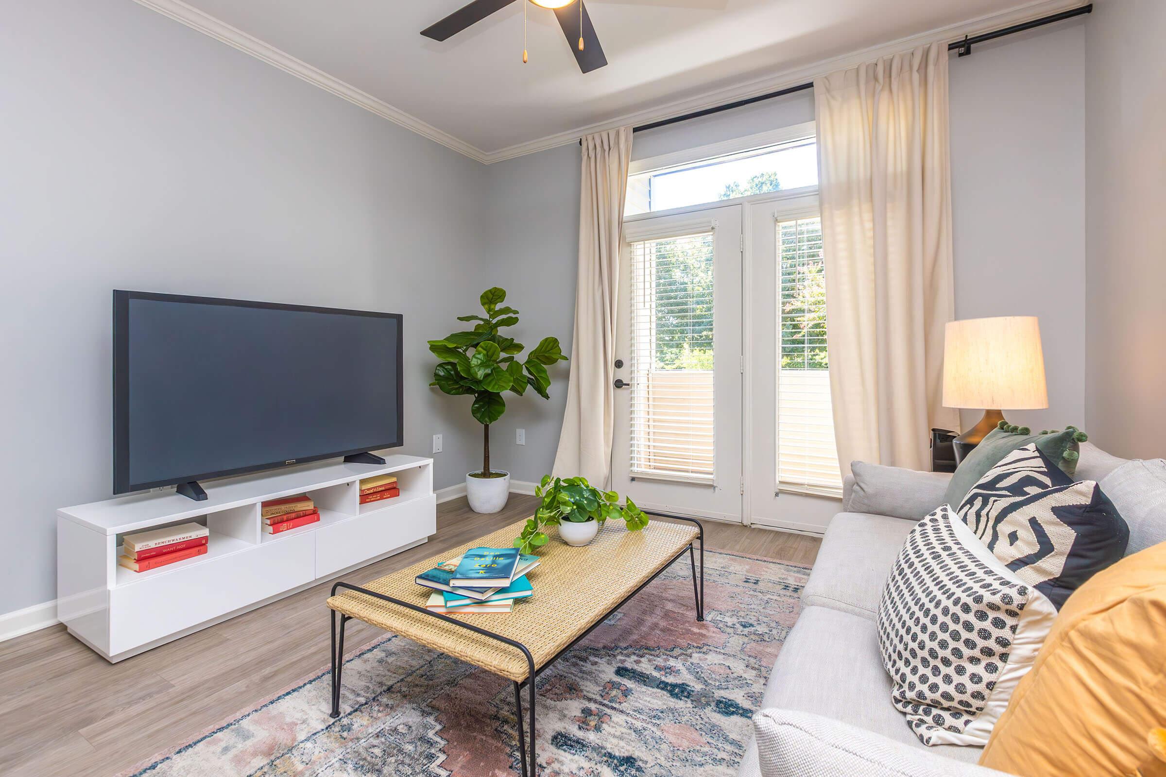 a flat screen tv sitting in a living room