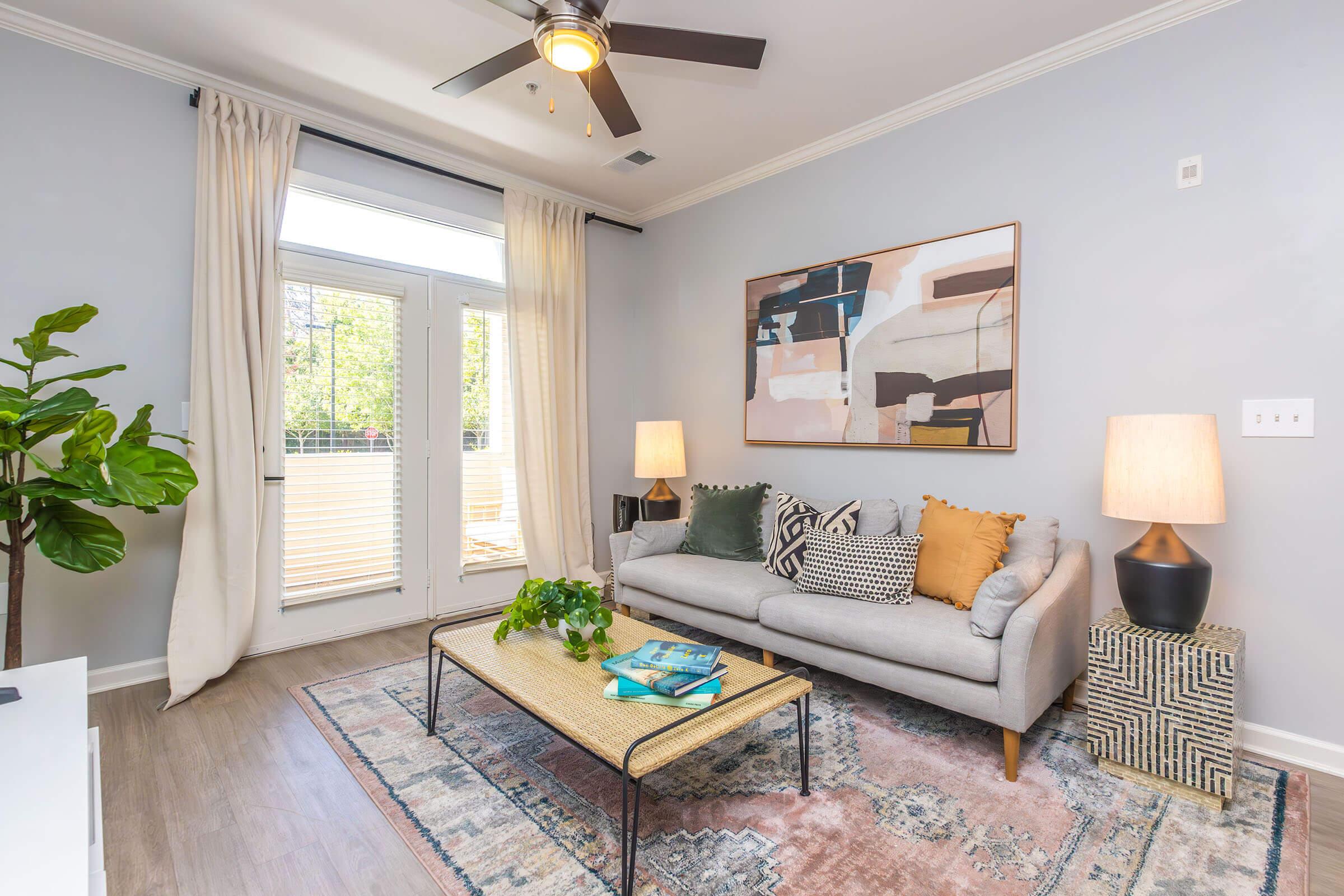 a living room filled with furniture and a fire place