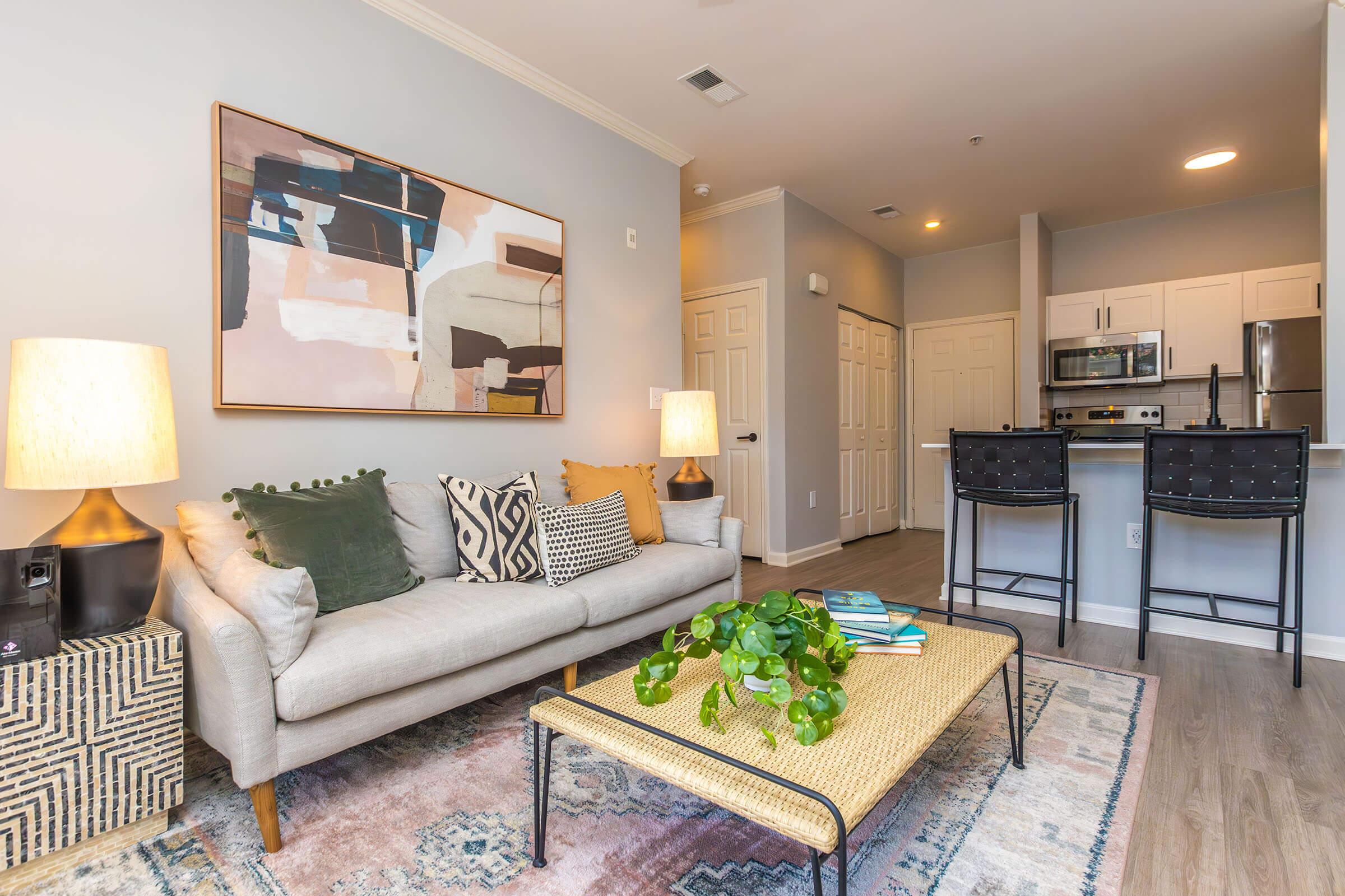 a living room filled with furniture and a fireplace