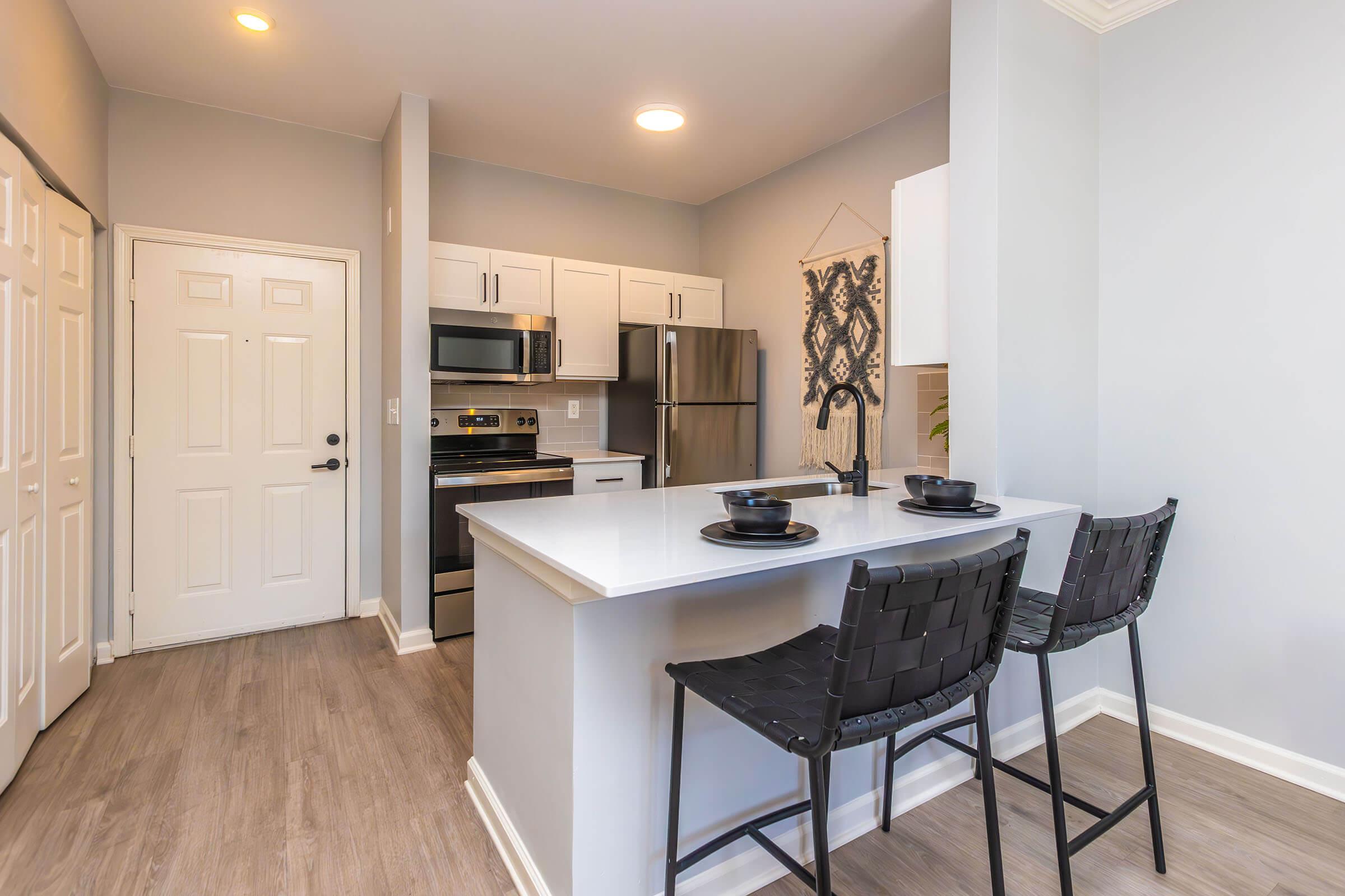 a kitchen with an island in the middle of a room