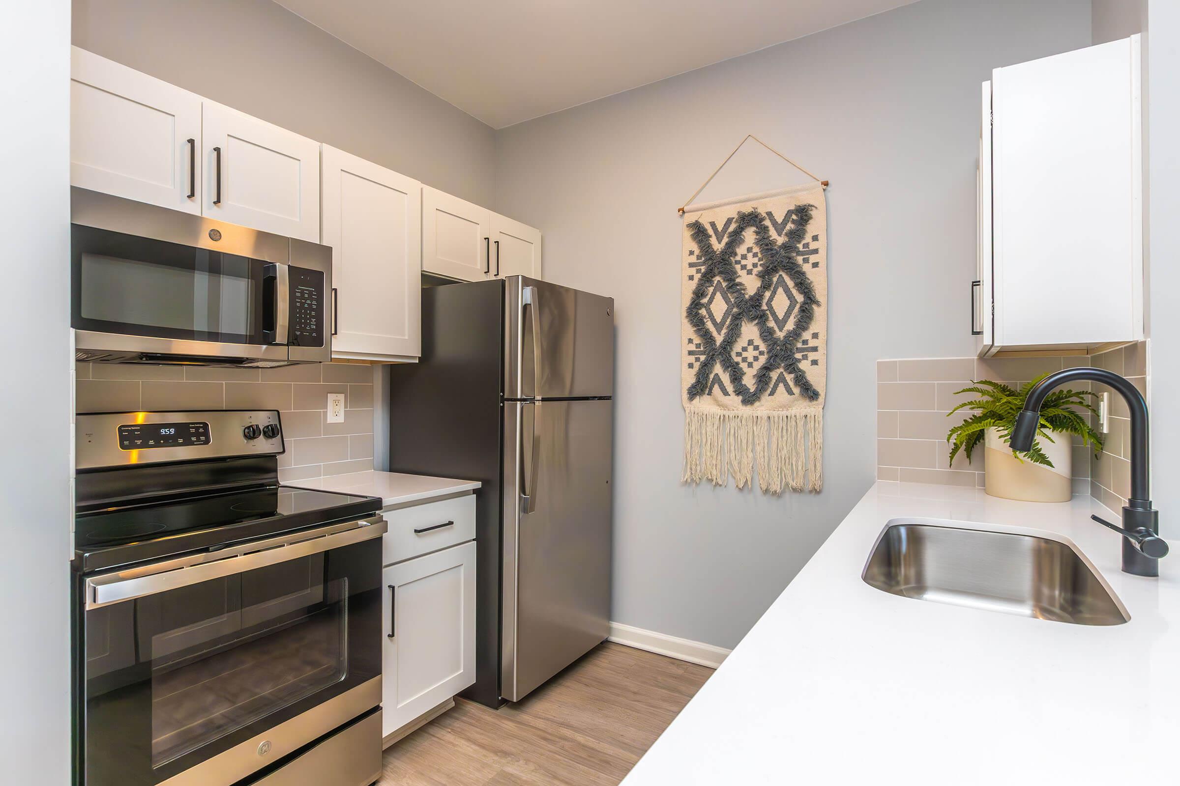 a modern kitchen with stainless steel appliances