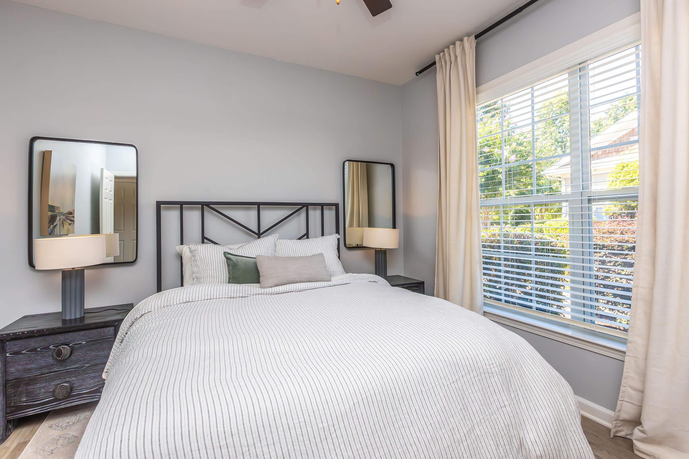 a bedroom with a bed in a hotel room