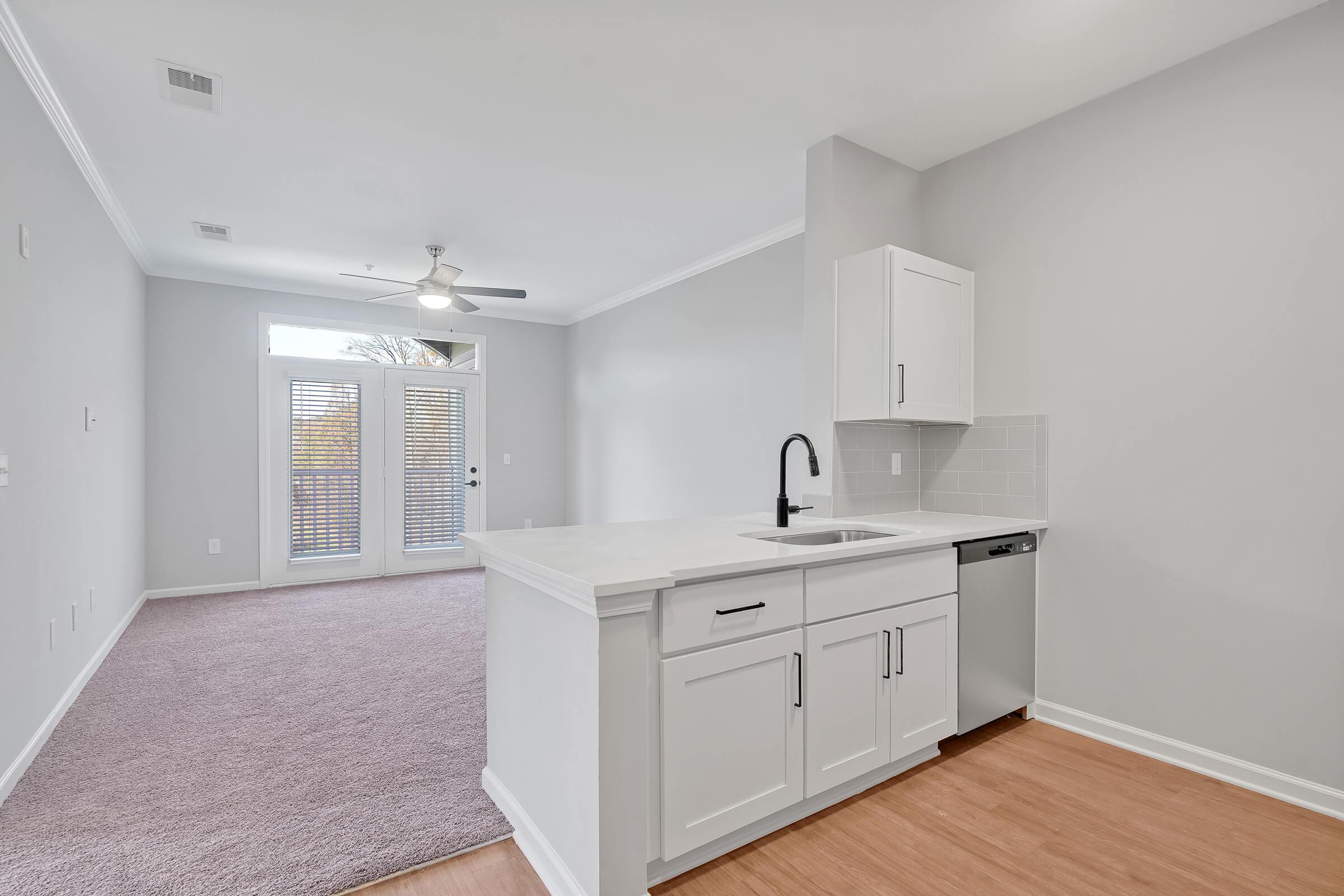 a kitchen with a sink and a microwave