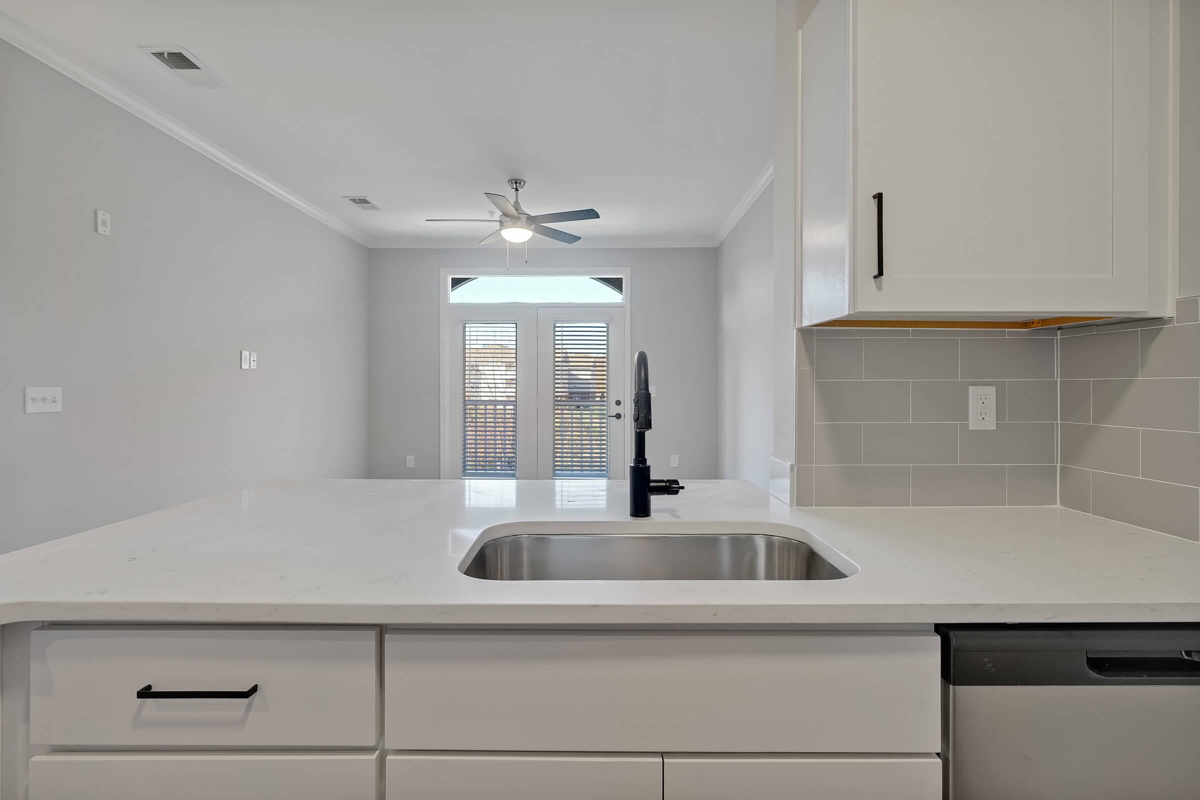 a kitchen with a stove and a sink