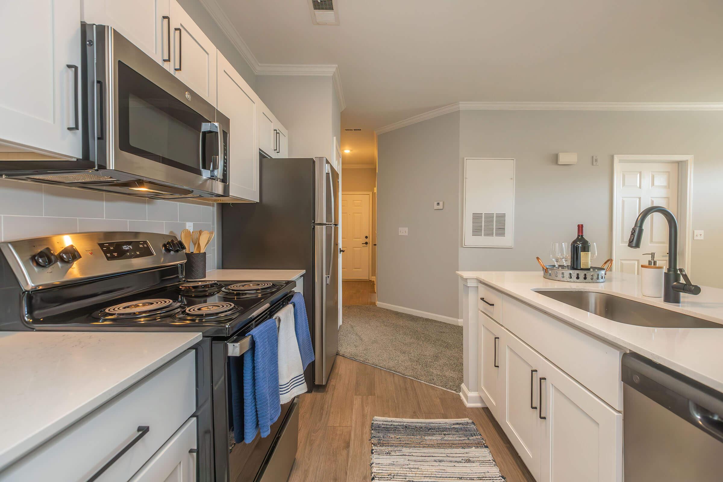 a kitchen with a stove top oven