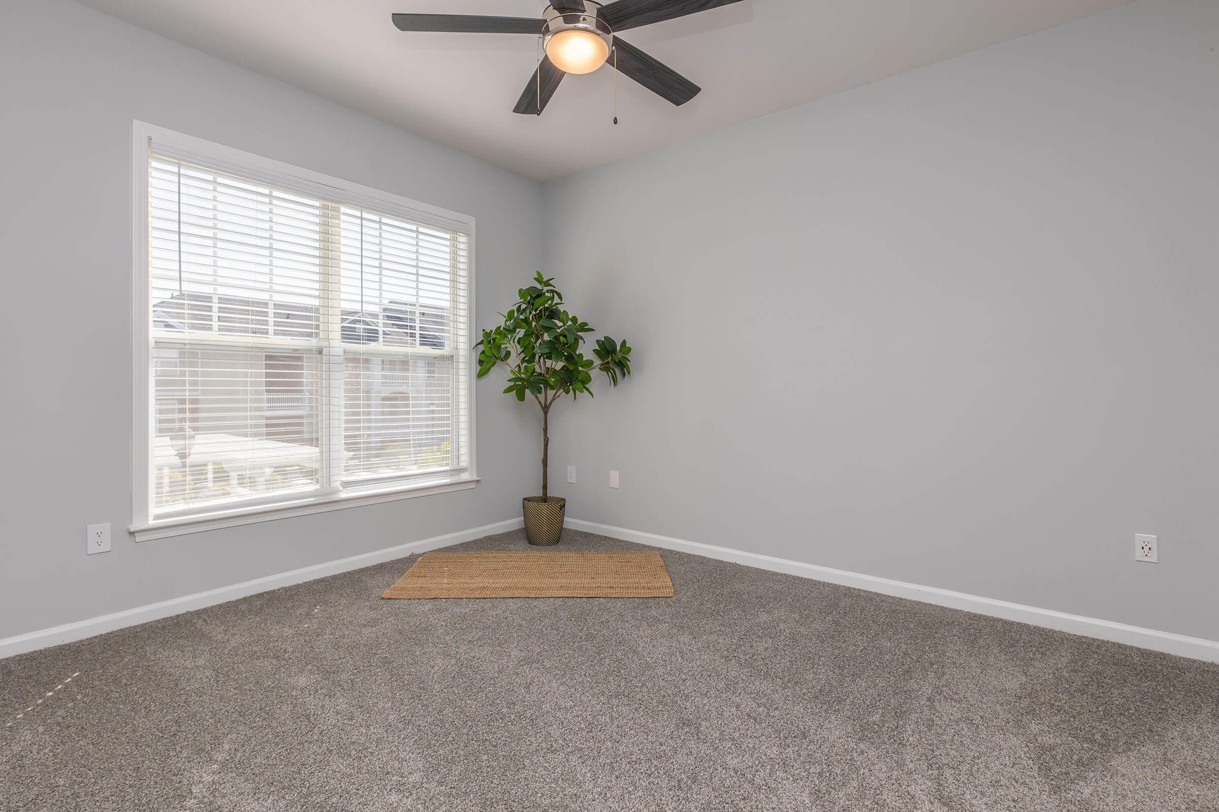 a bedroom with a large window