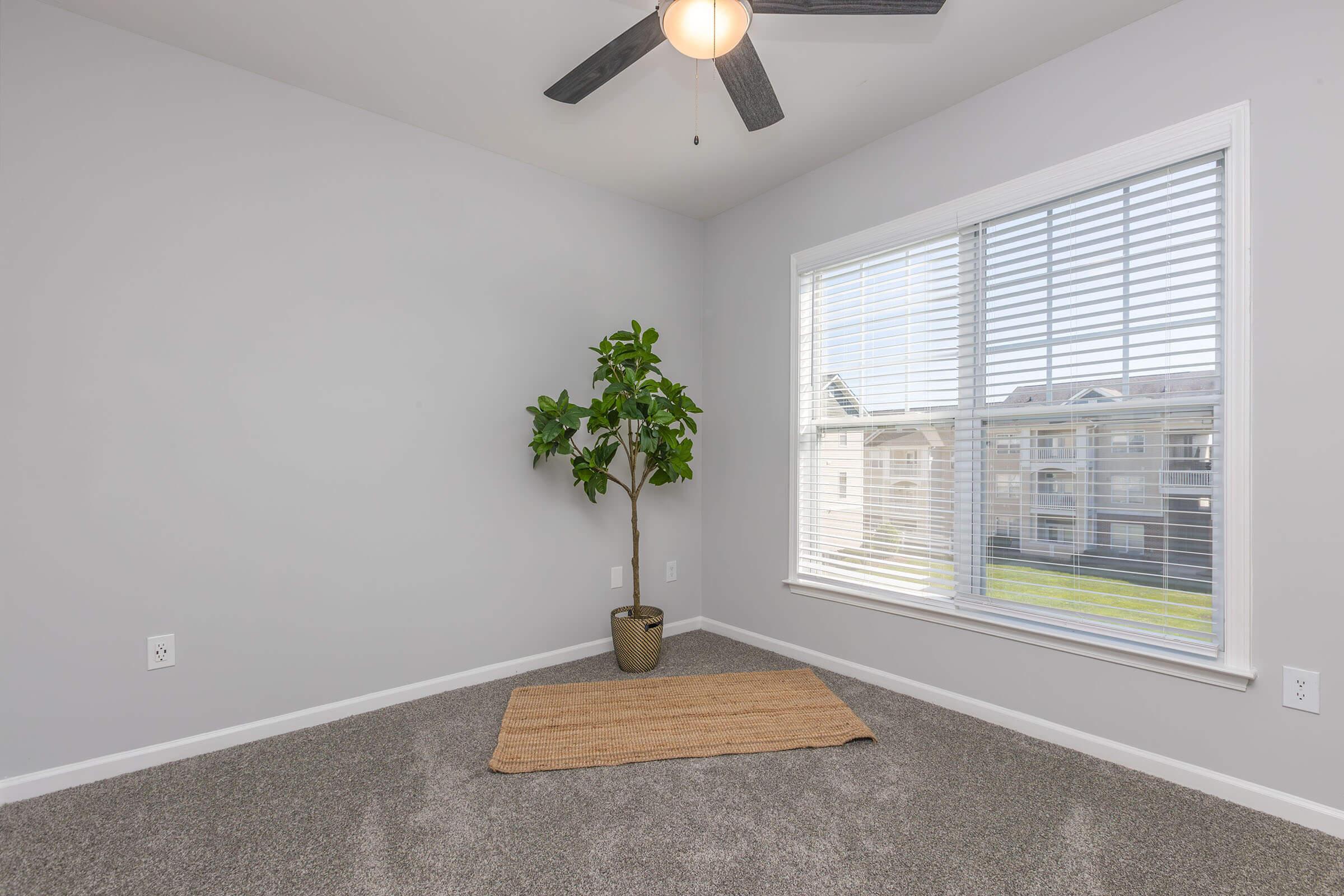 a bedroom with a large window