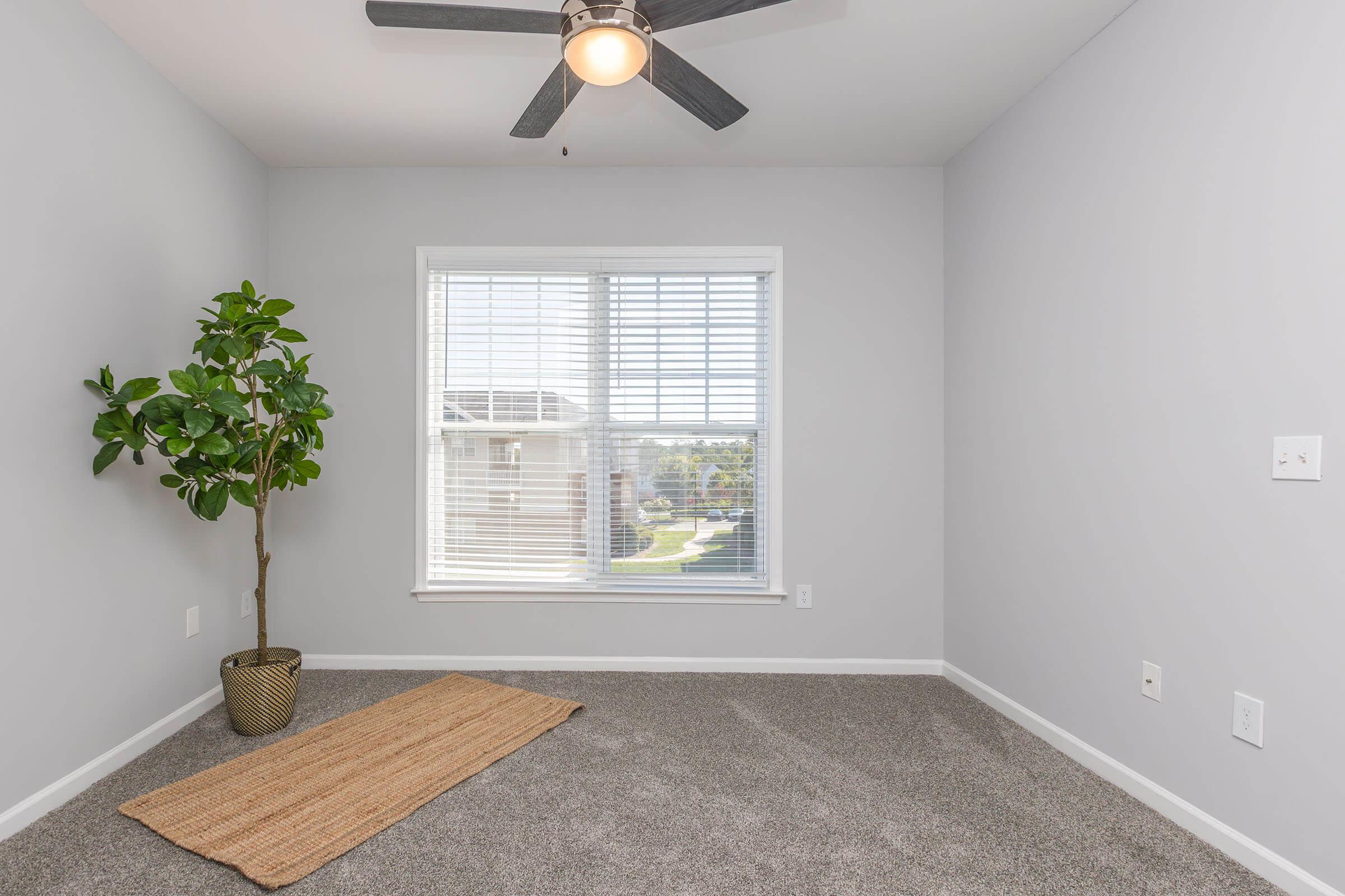 a bedroom with a large window