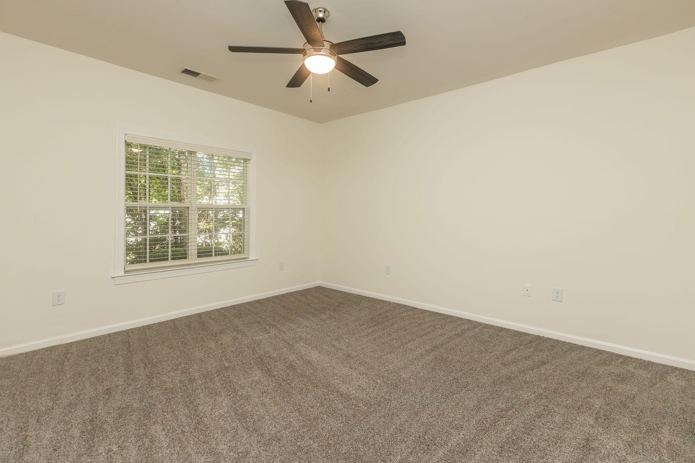 a bedroom with a large window