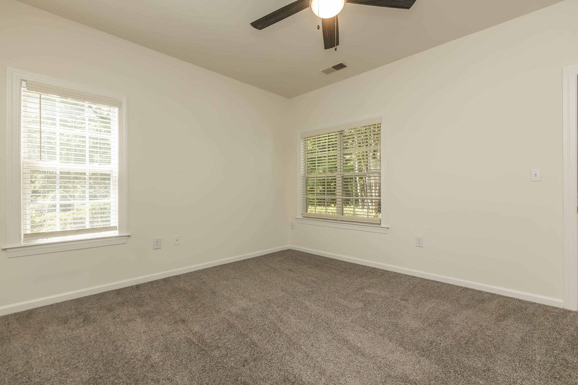 a bedroom with a large window