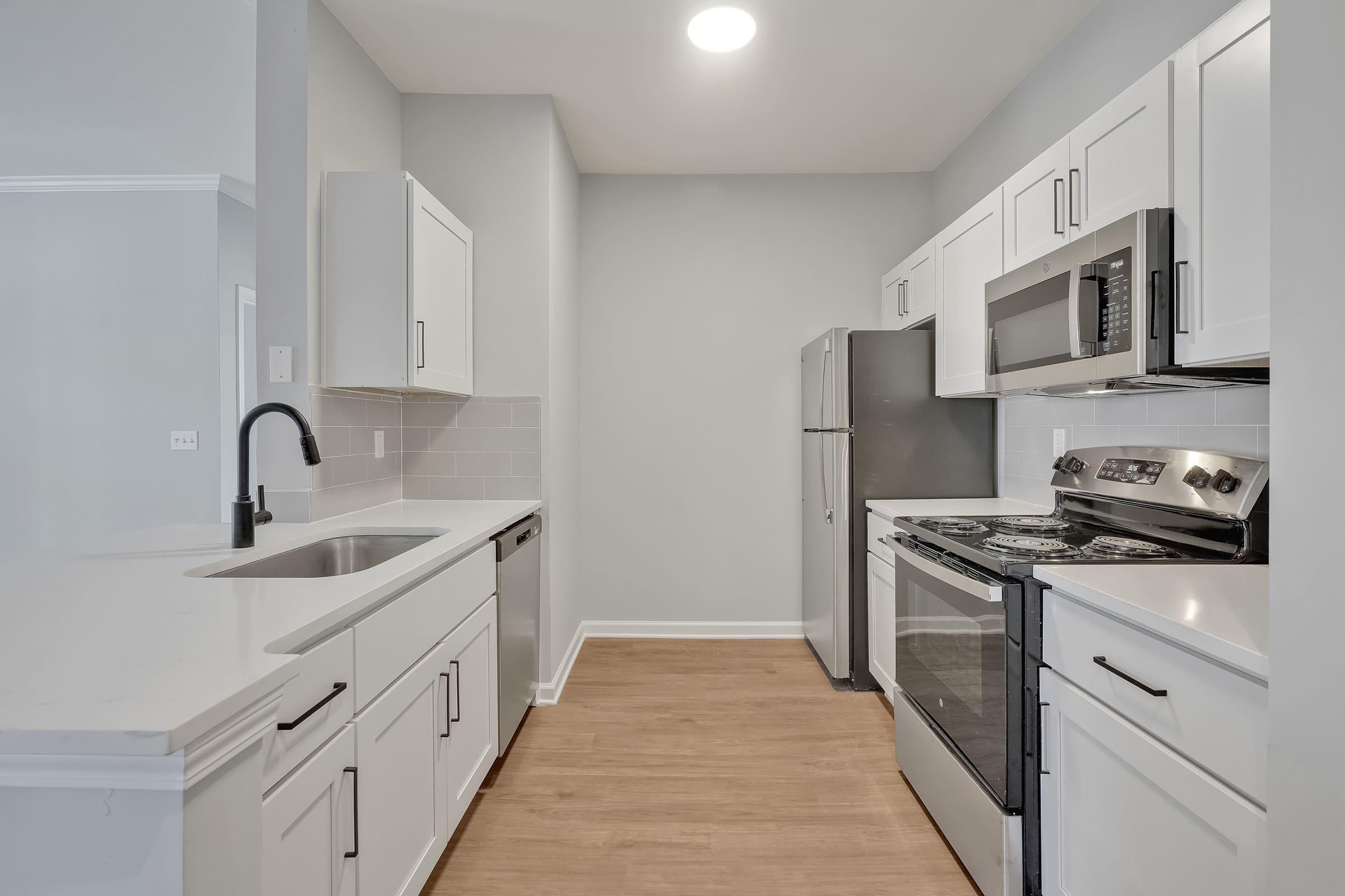 a kitchen with a stove and a refrigerator