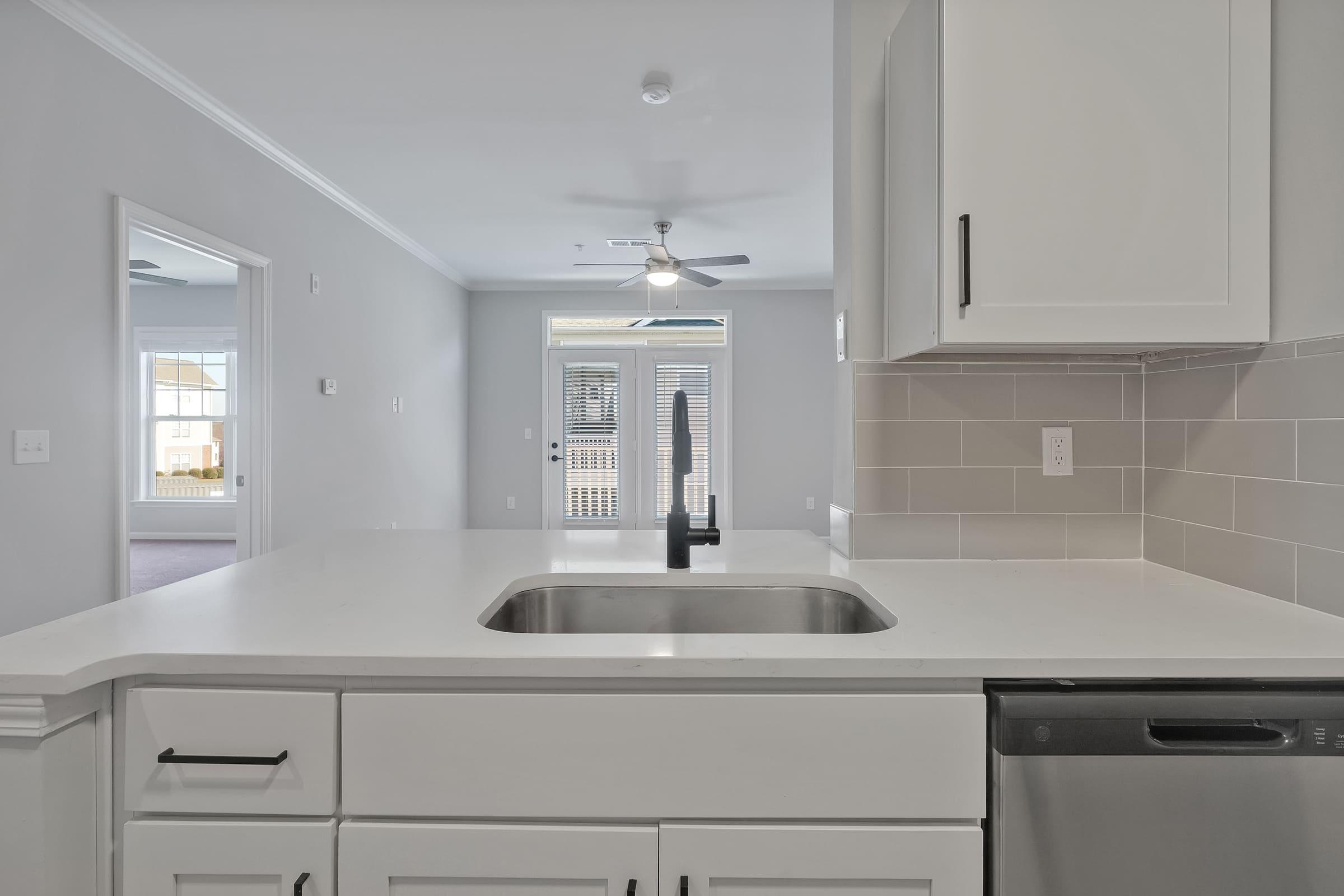 a kitchen with a sink and a microwave