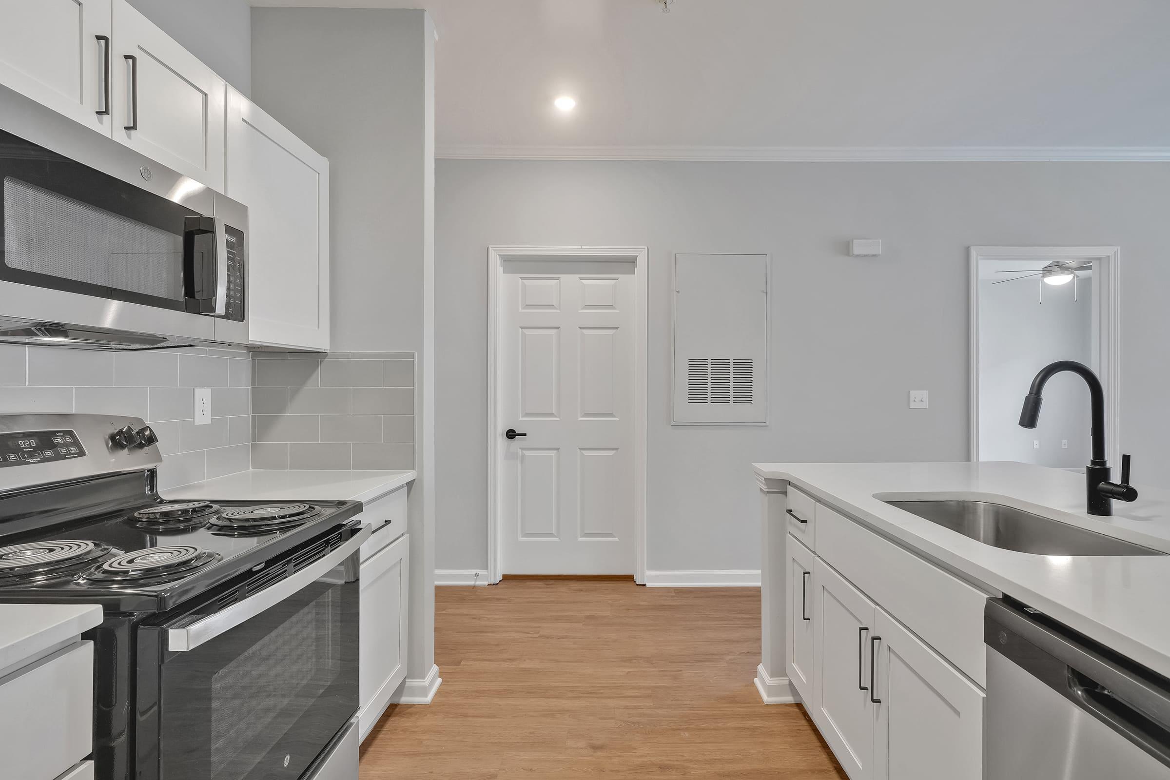 a kitchen with a stove and a sink