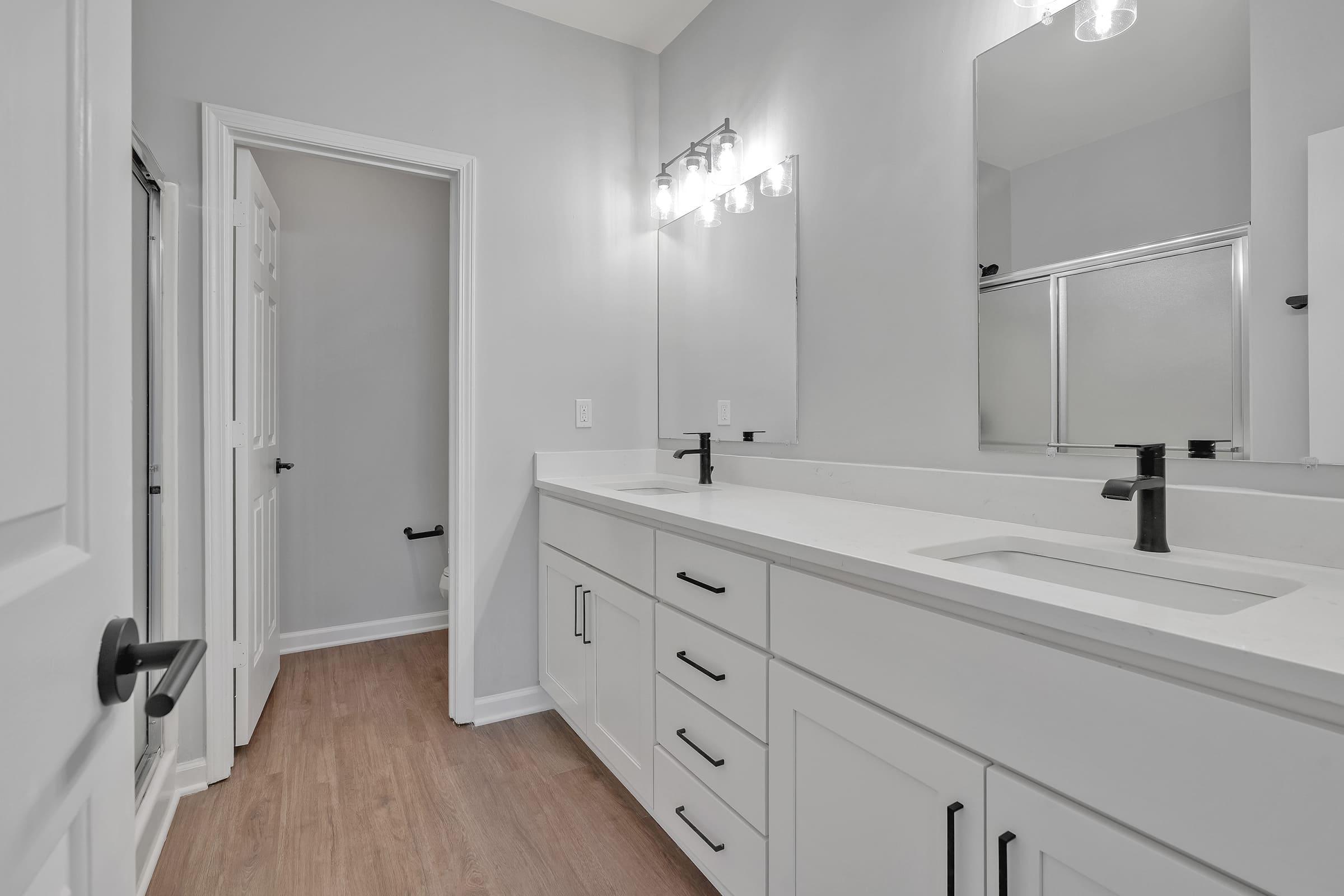 a kitchen with a sink and a mirror