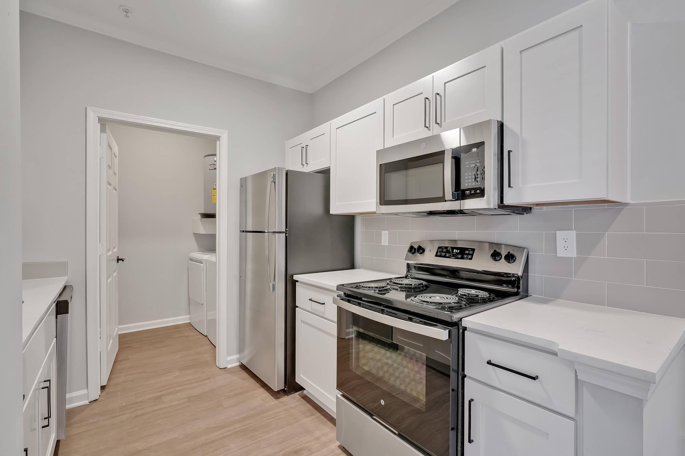 a kitchen with a stove and a refrigerator