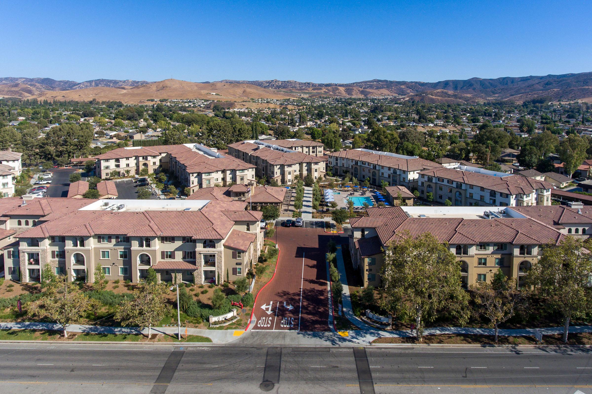 a large building with a mountain in the background