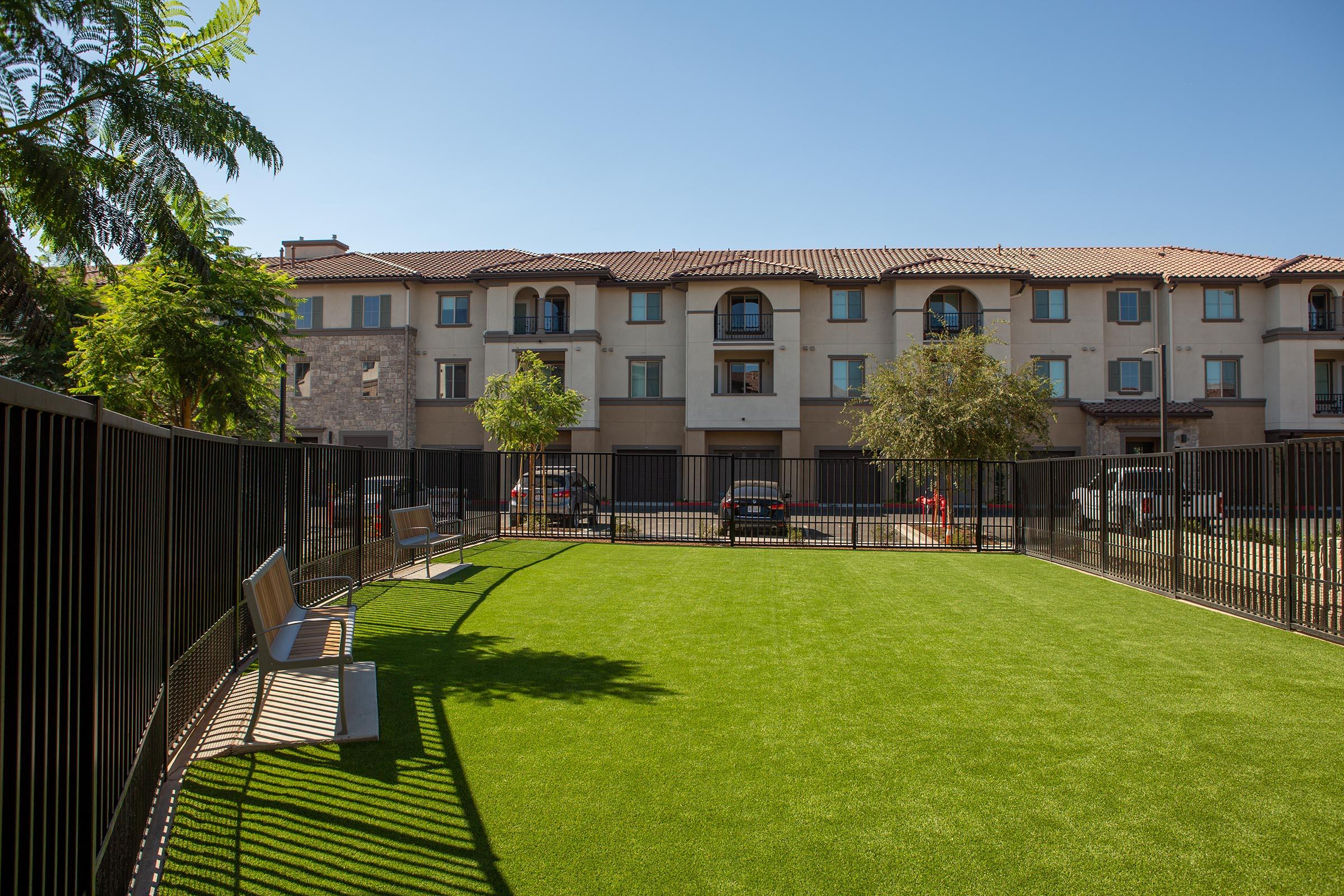 Three-Bedroom Apartments In Simi Valley, CA - The Landing At Arroyo - Fenced Dog Park With Benches And Lush Grass