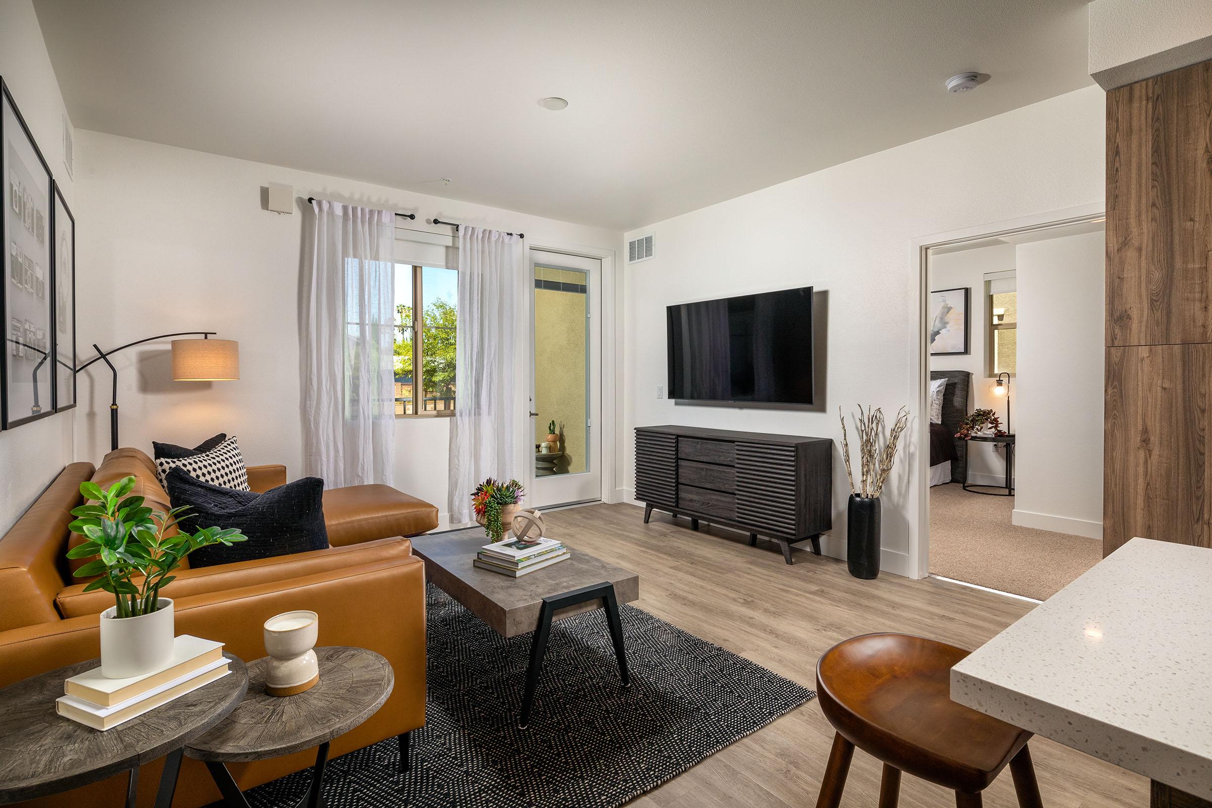 a living room filled with furniture and a table