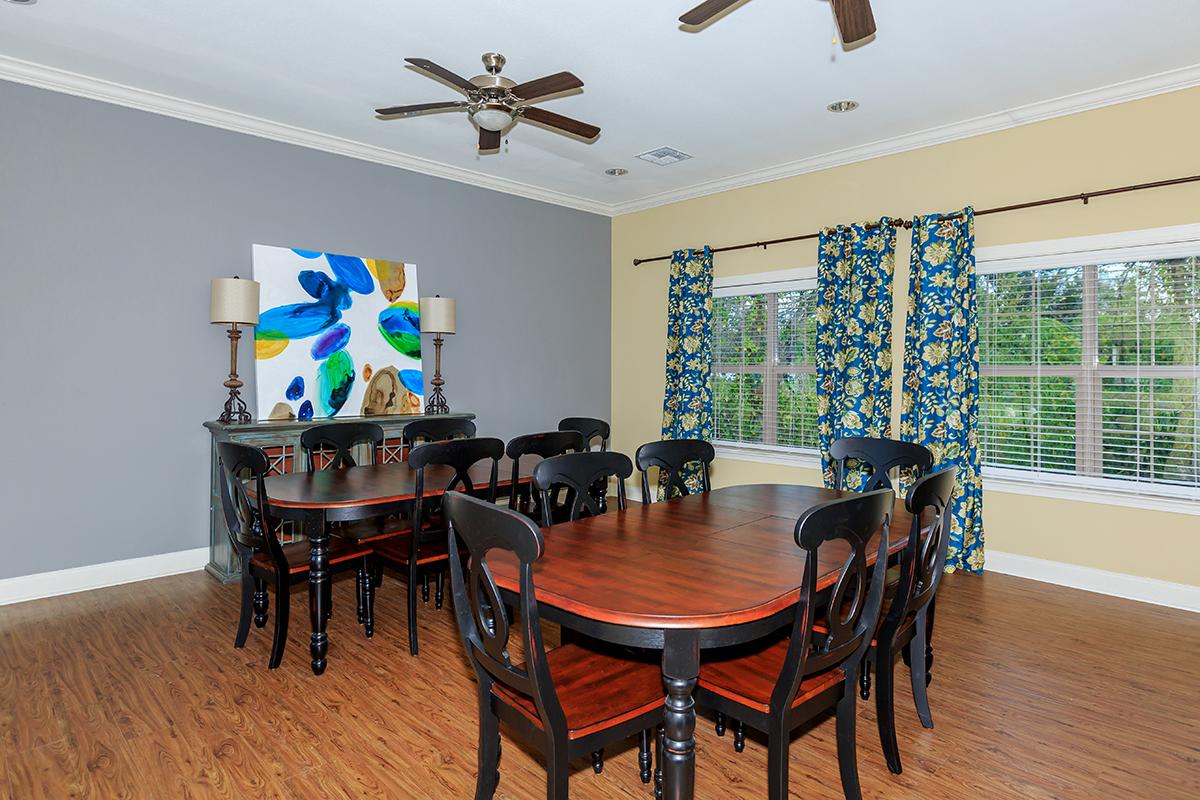 a living room filled with furniture and a large window