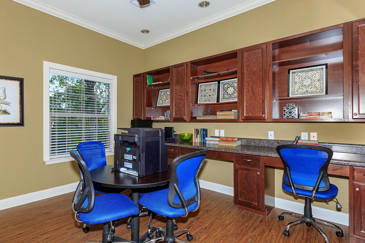 a living room filled with furniture and a large window