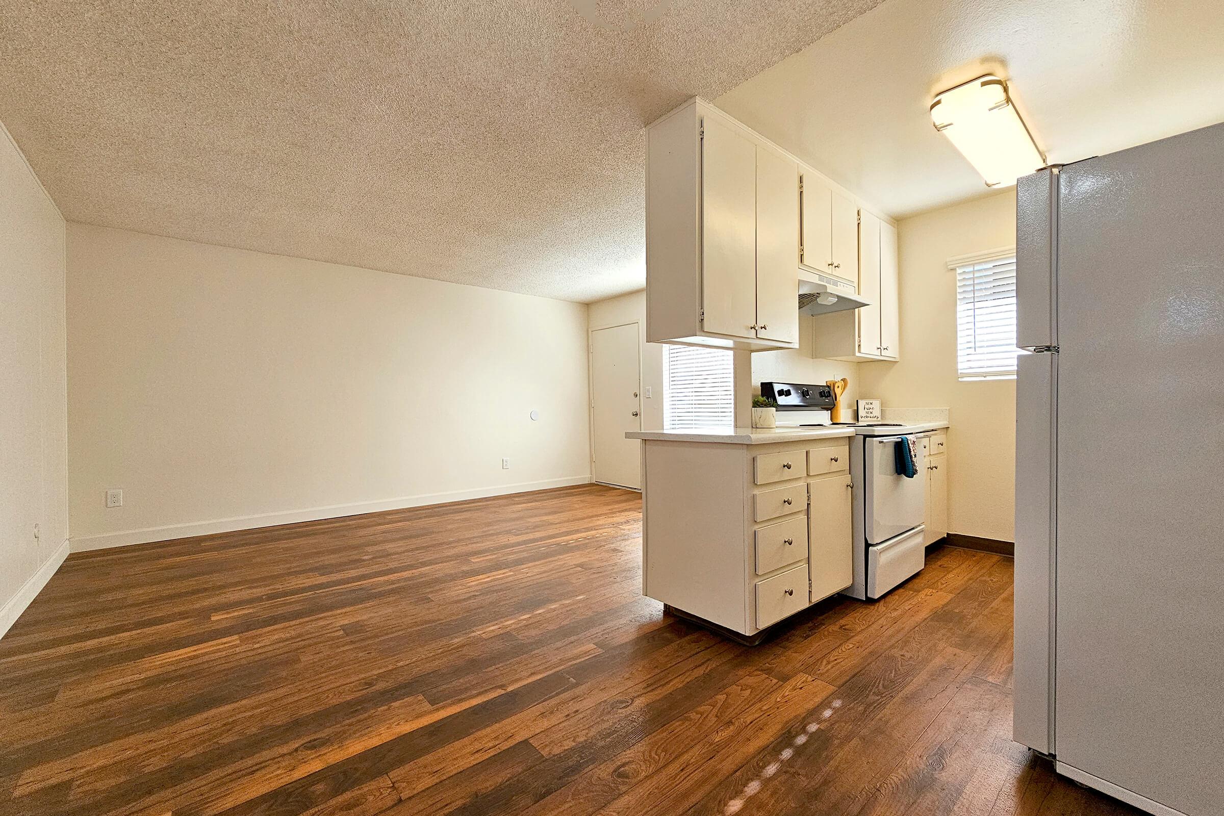 a kitchen with a wooden floor