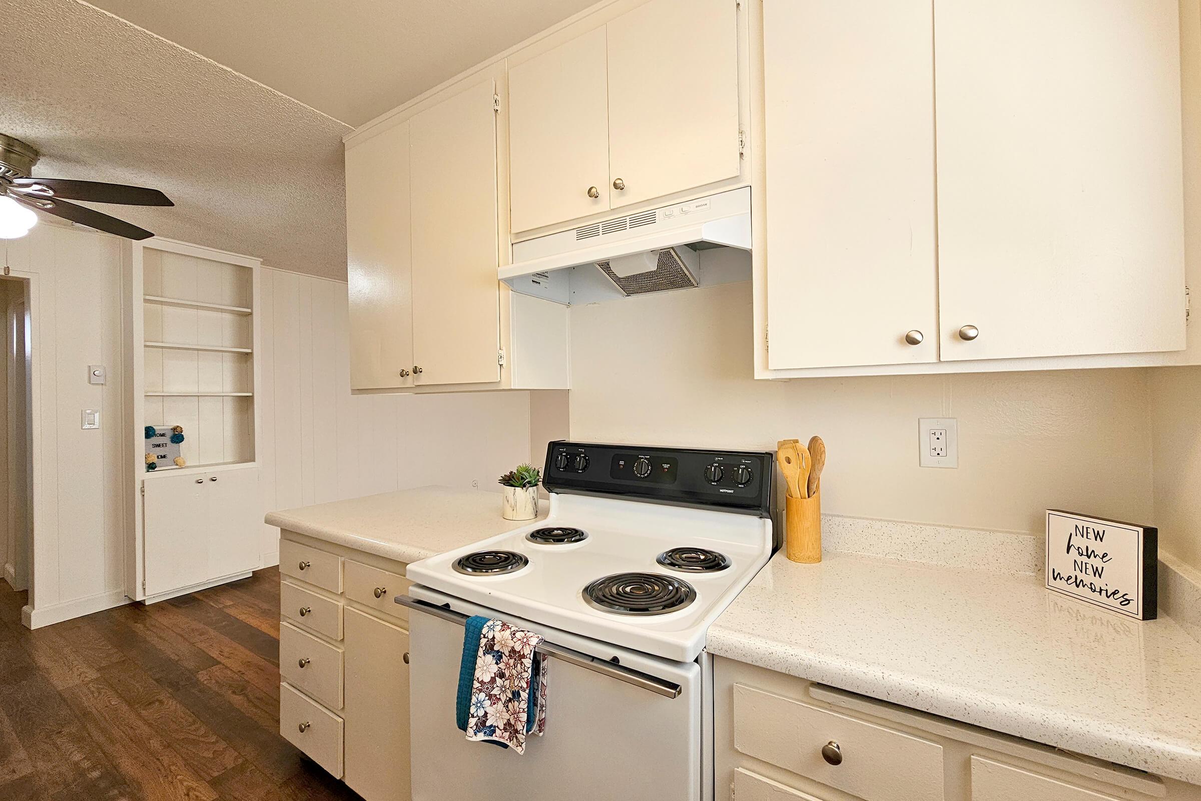 a kitchen with a stove sink and refrigerator