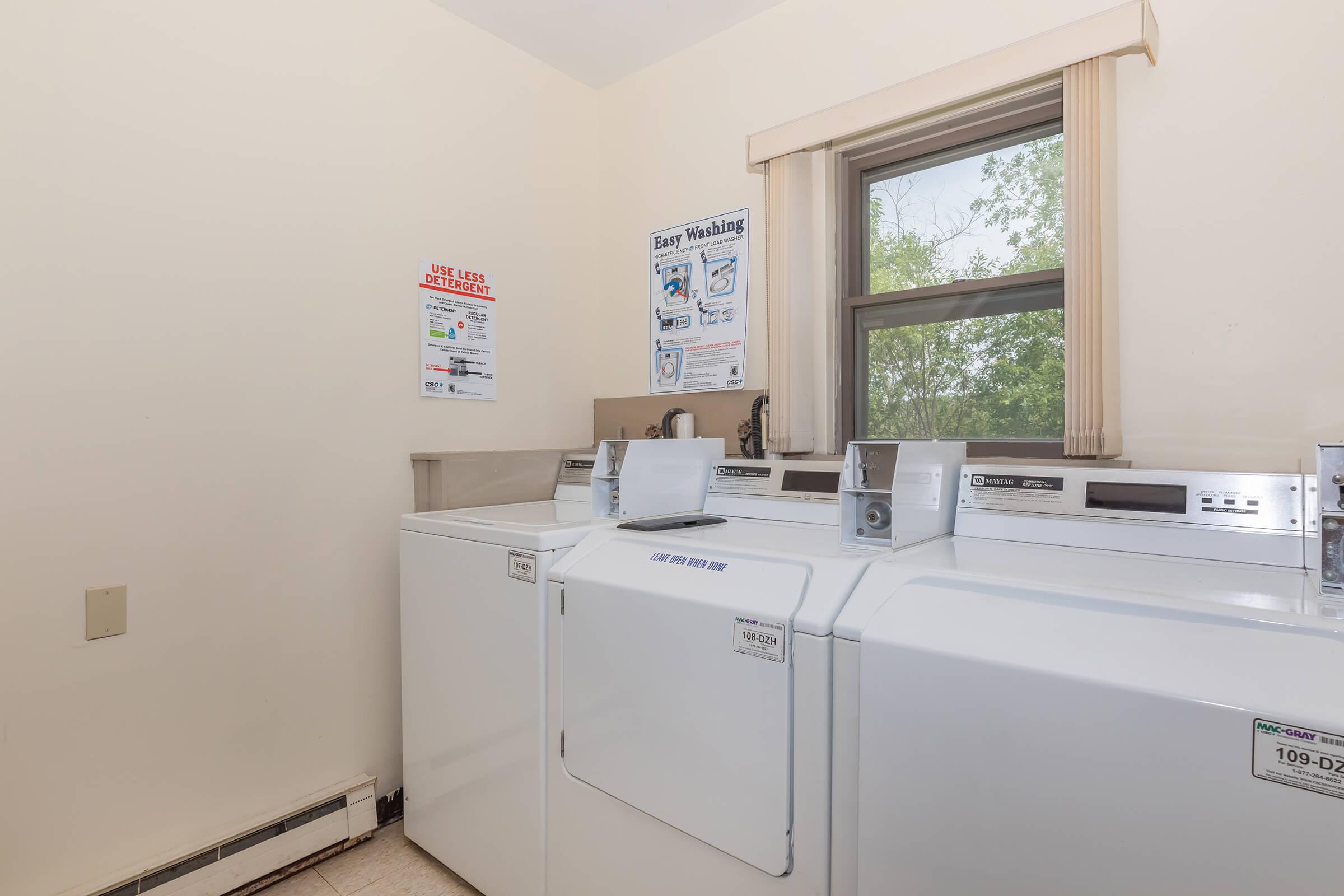 a white refrigerator freezer sitting next to a sink