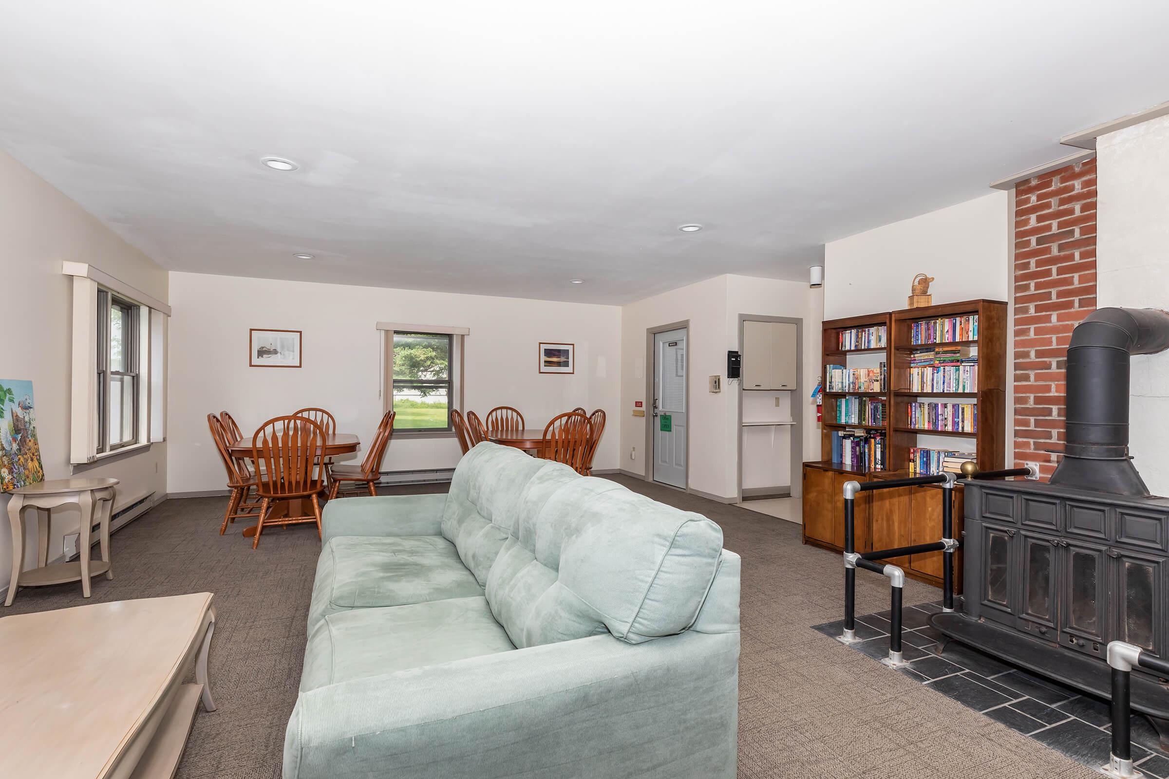 a living room filled with furniture and a flat screen tv