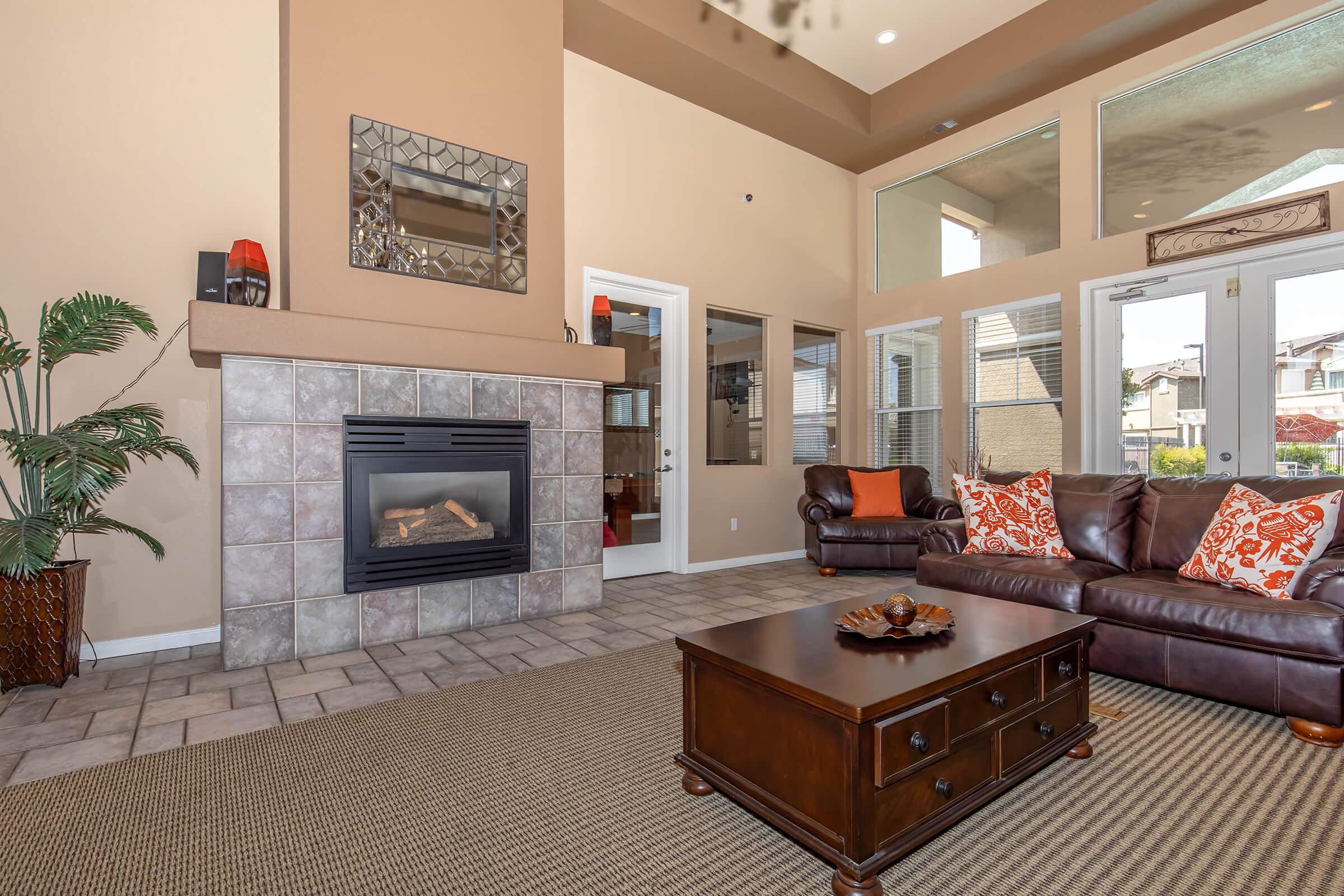 a living room filled with furniture and a fire place