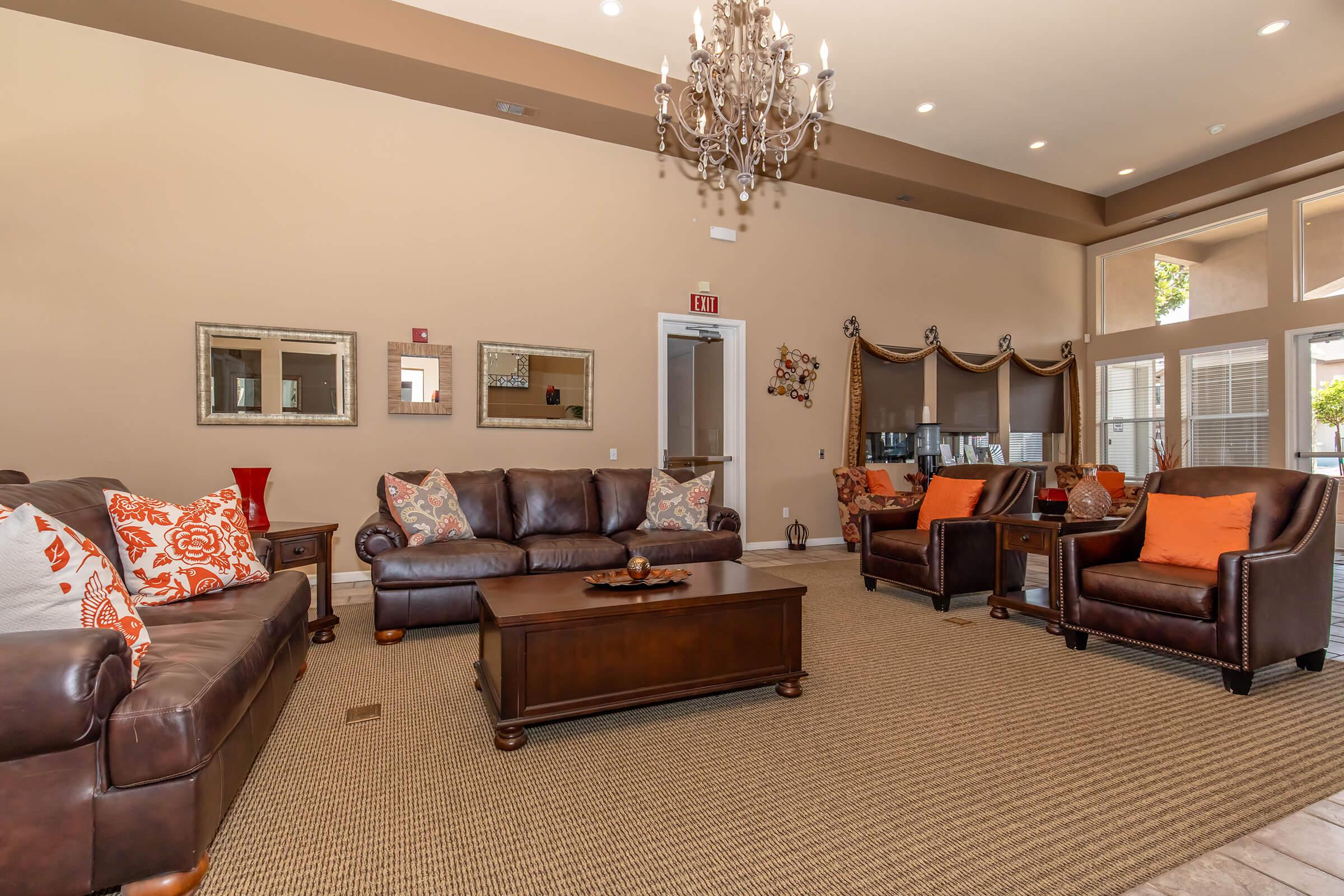 a living room filled with furniture and a flat screen tv