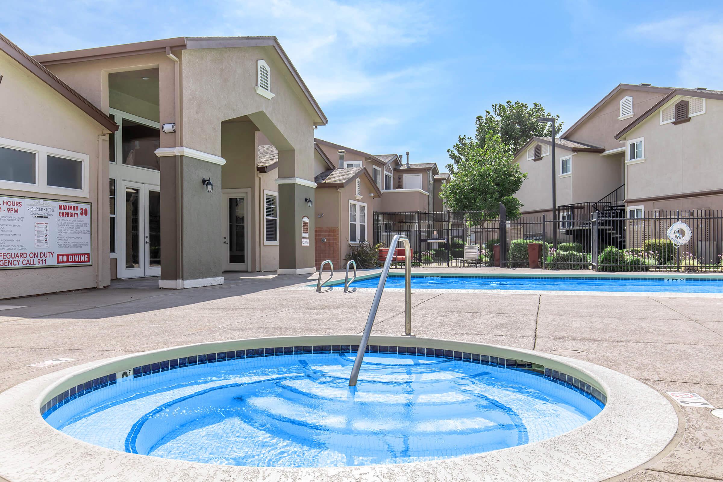 a pool of water in front of a house