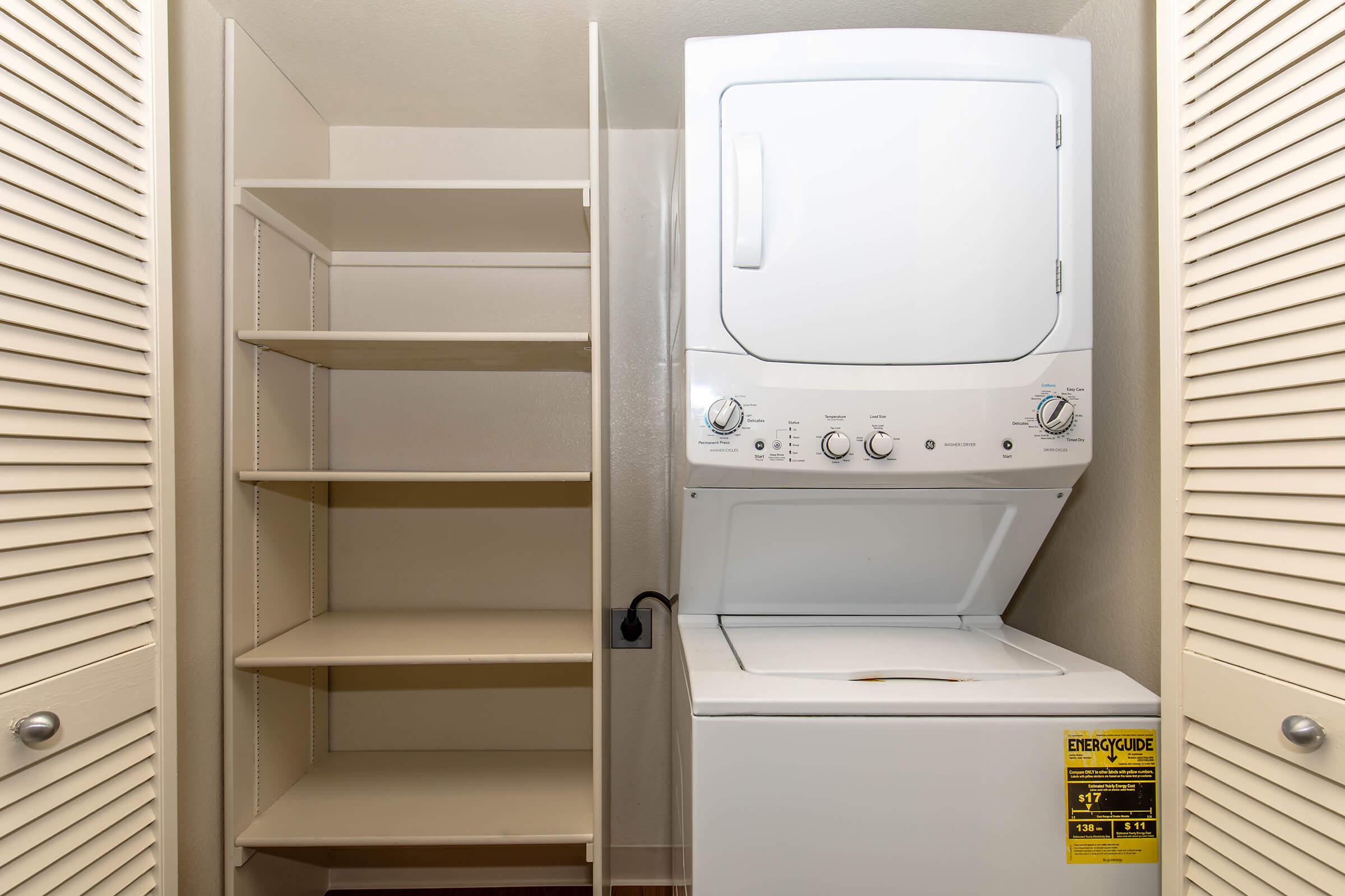 a microwave oven sitting on top of a refrigerator