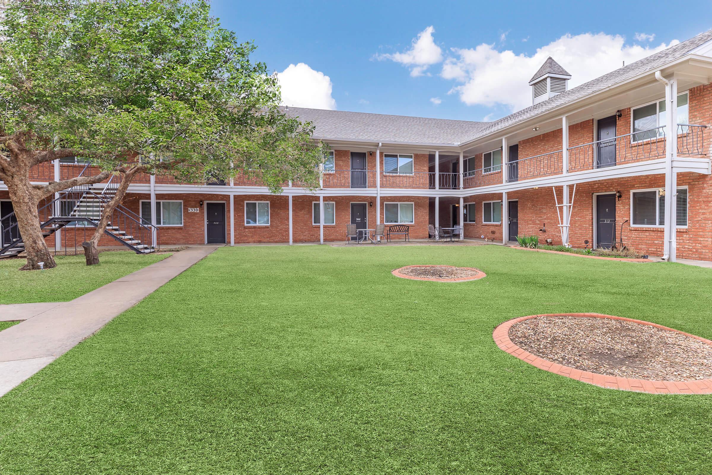 a large lawn in front of a building