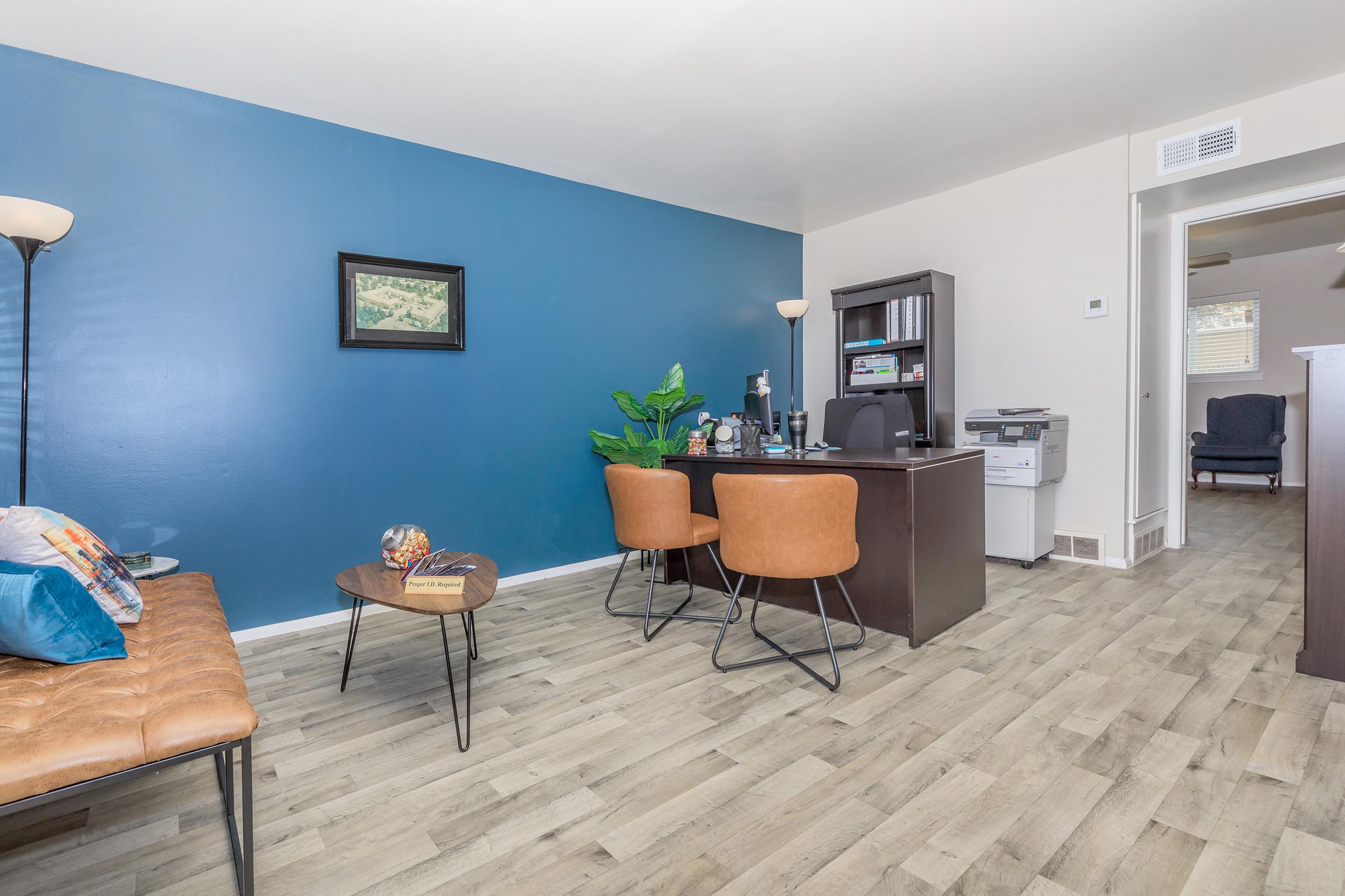 a living room filled with furniture and a flat screen tv