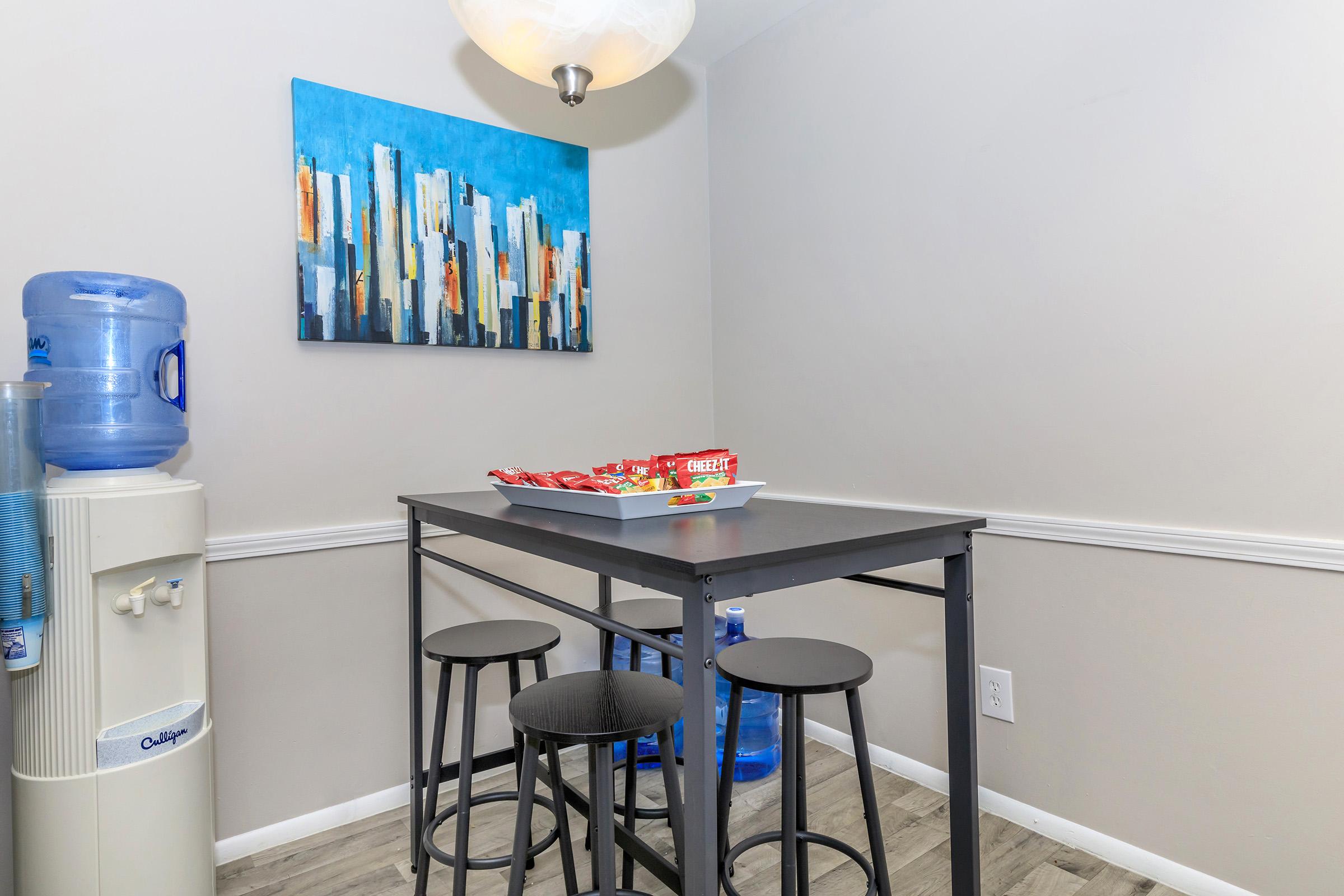 a kitchen with a blue chair