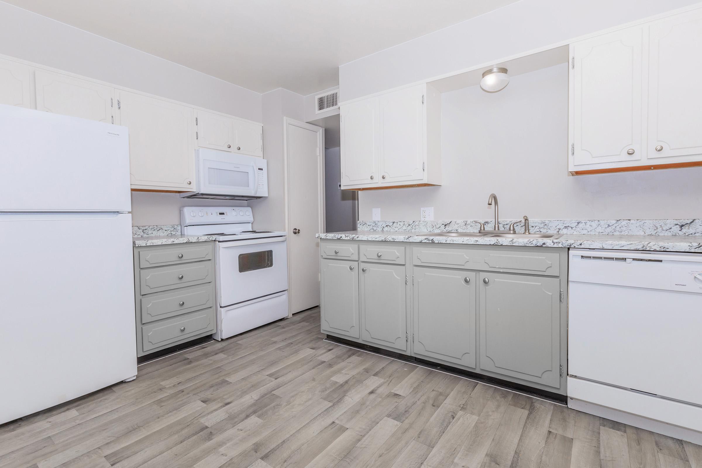 a kitchen with a stove and a refrigerator