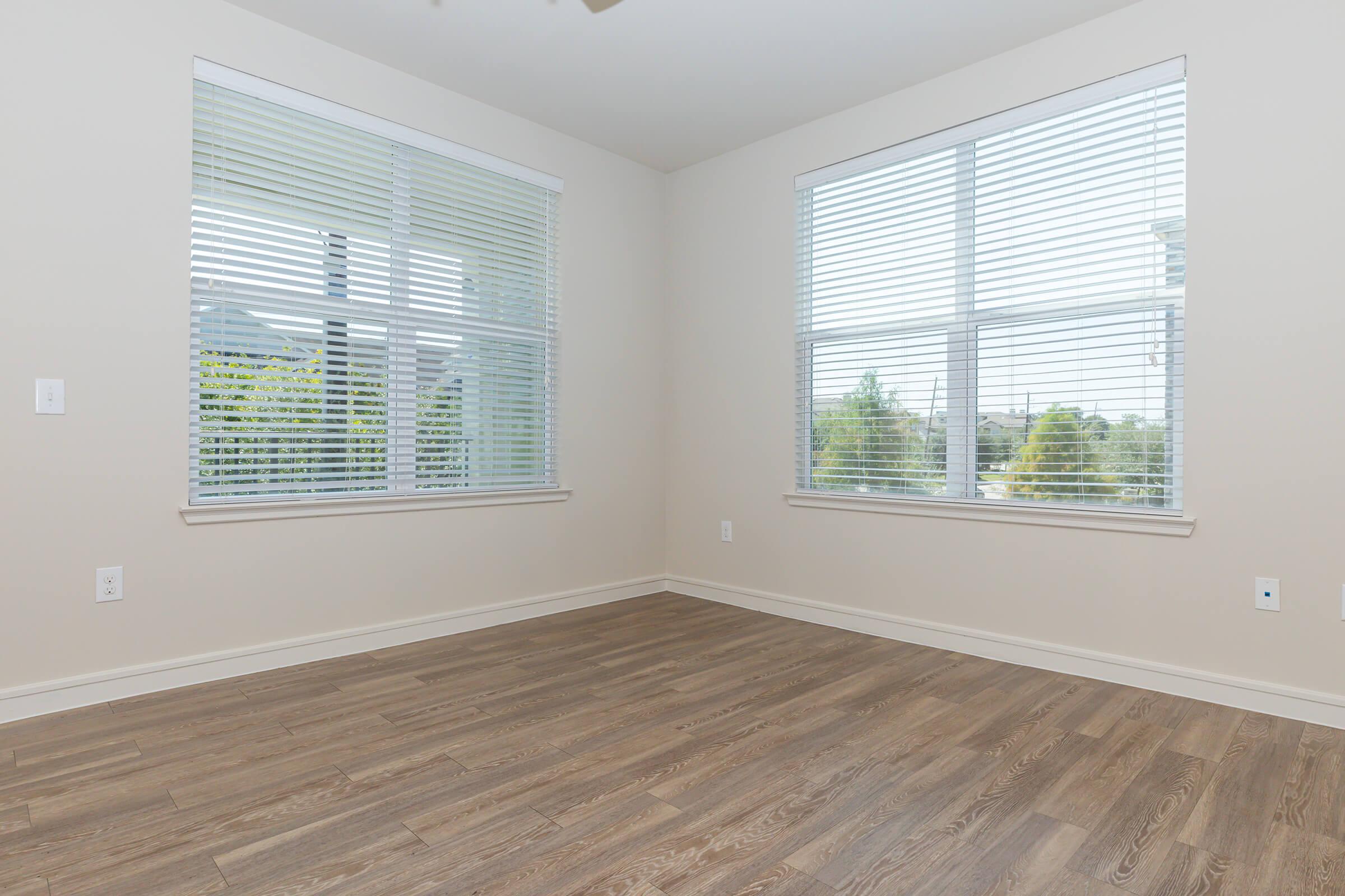 unfurnished bedroom with wooden floors