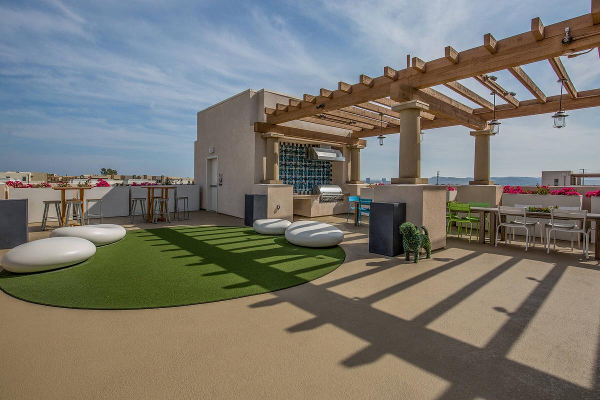 Rooftop community space filled with furniture