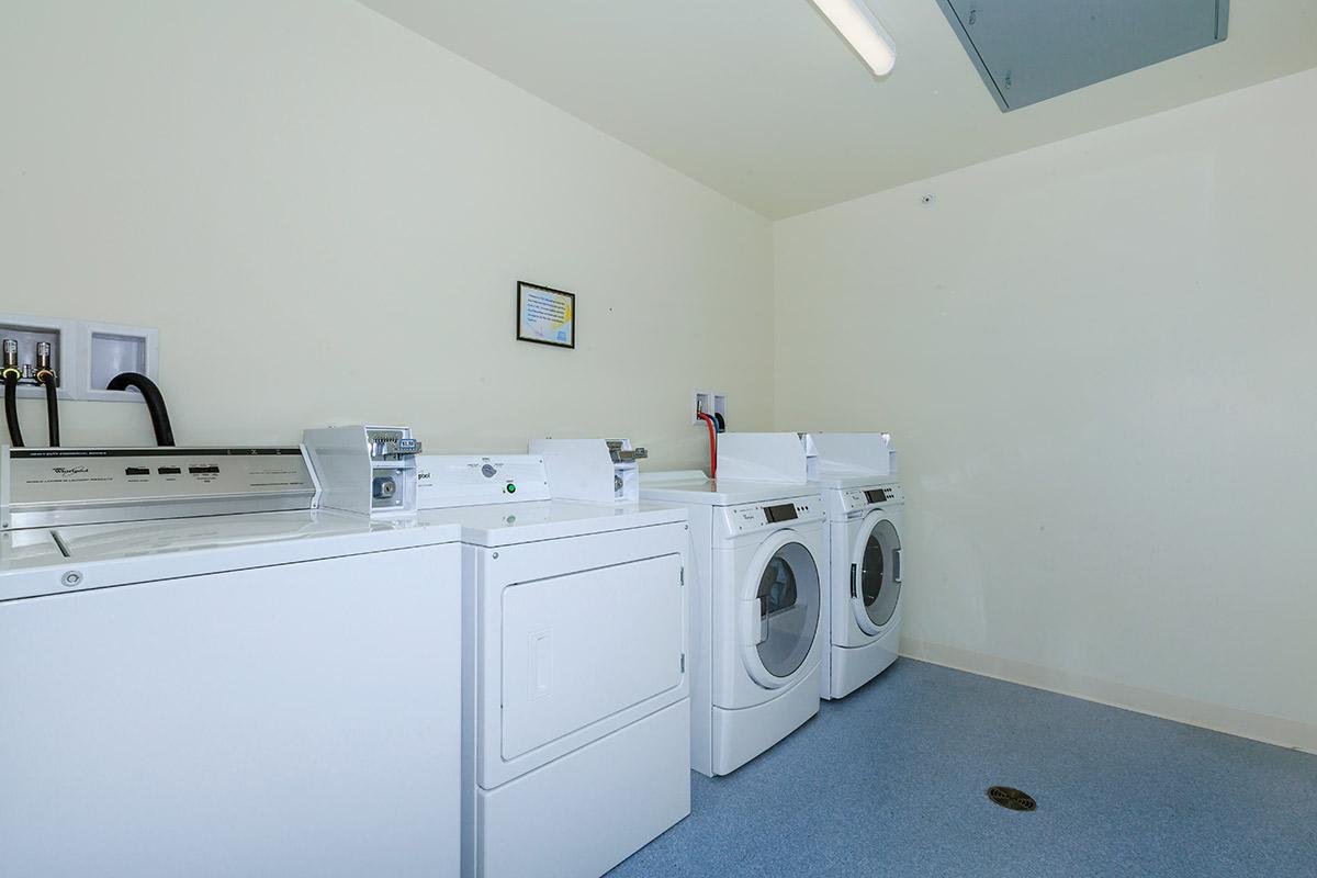 a white refrigerator freezer sitting inside of a kitchen