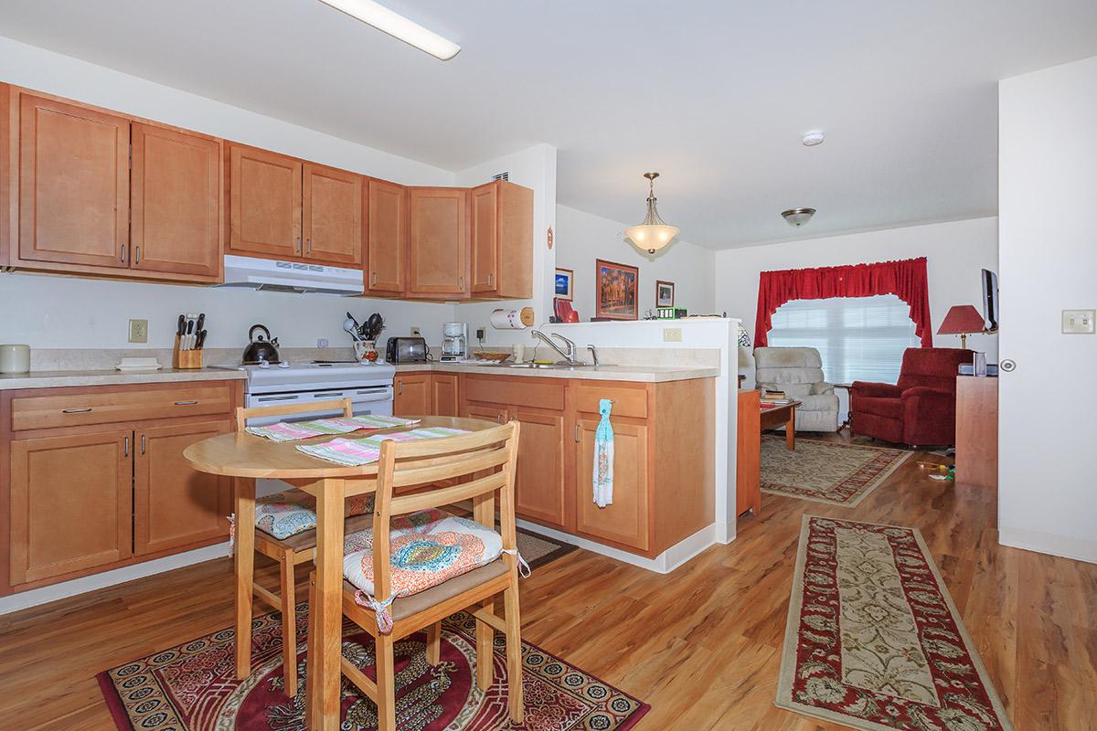 a kitchen with a wood floor