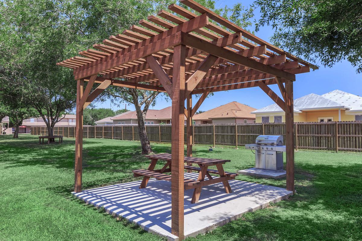 a group of lawn chairs sitting on top of a wooden table