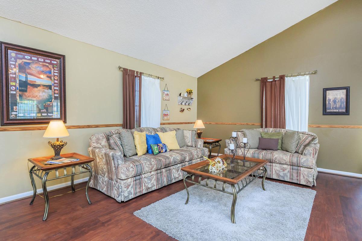 a living room filled with furniture and a fireplace