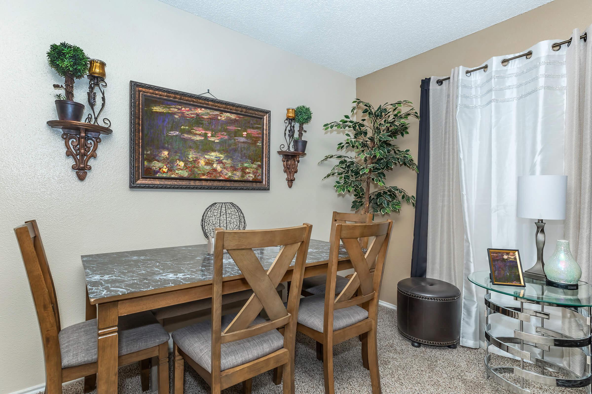 a room filled with furniture and vase on a table