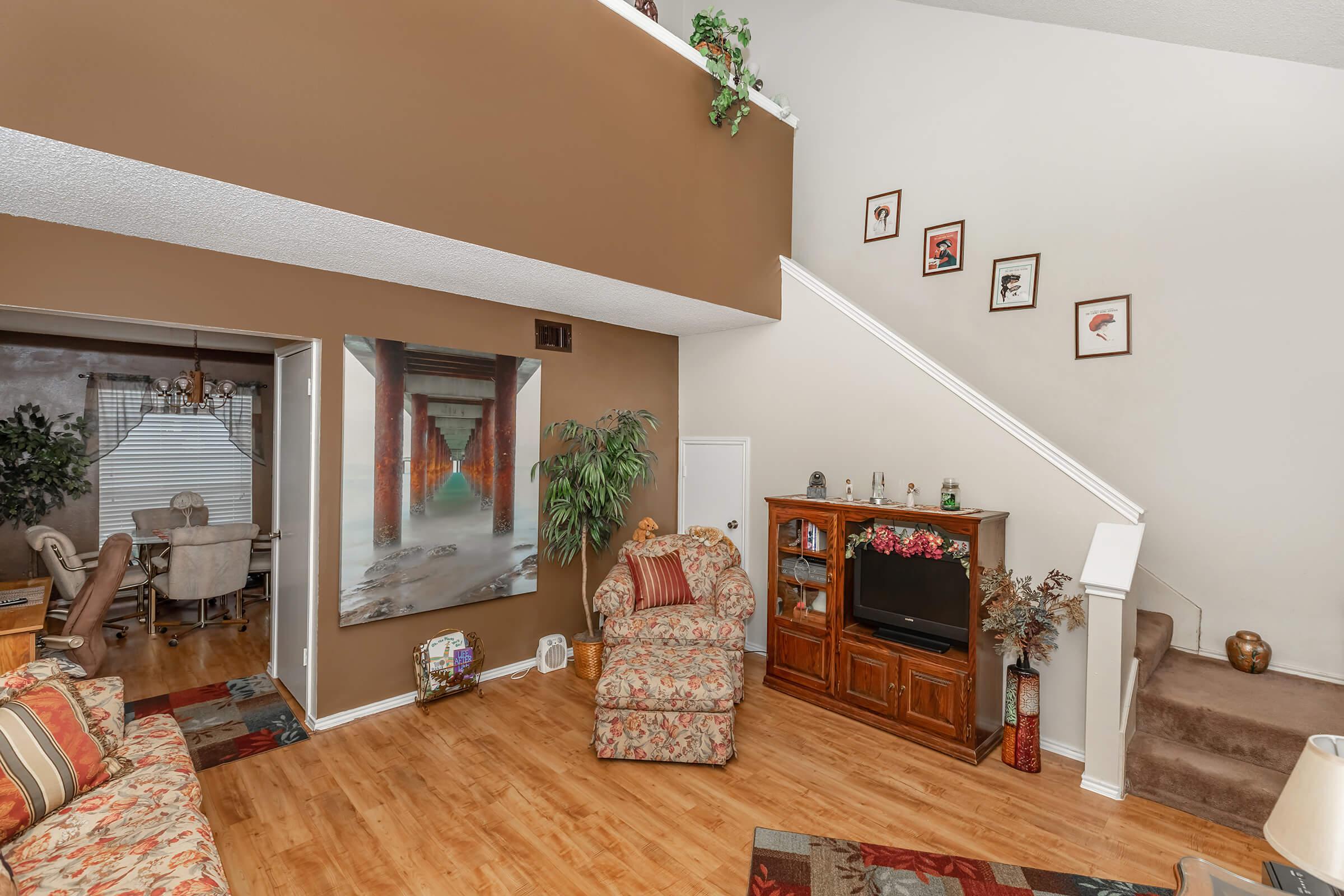 a living room filled with furniture and a fire place