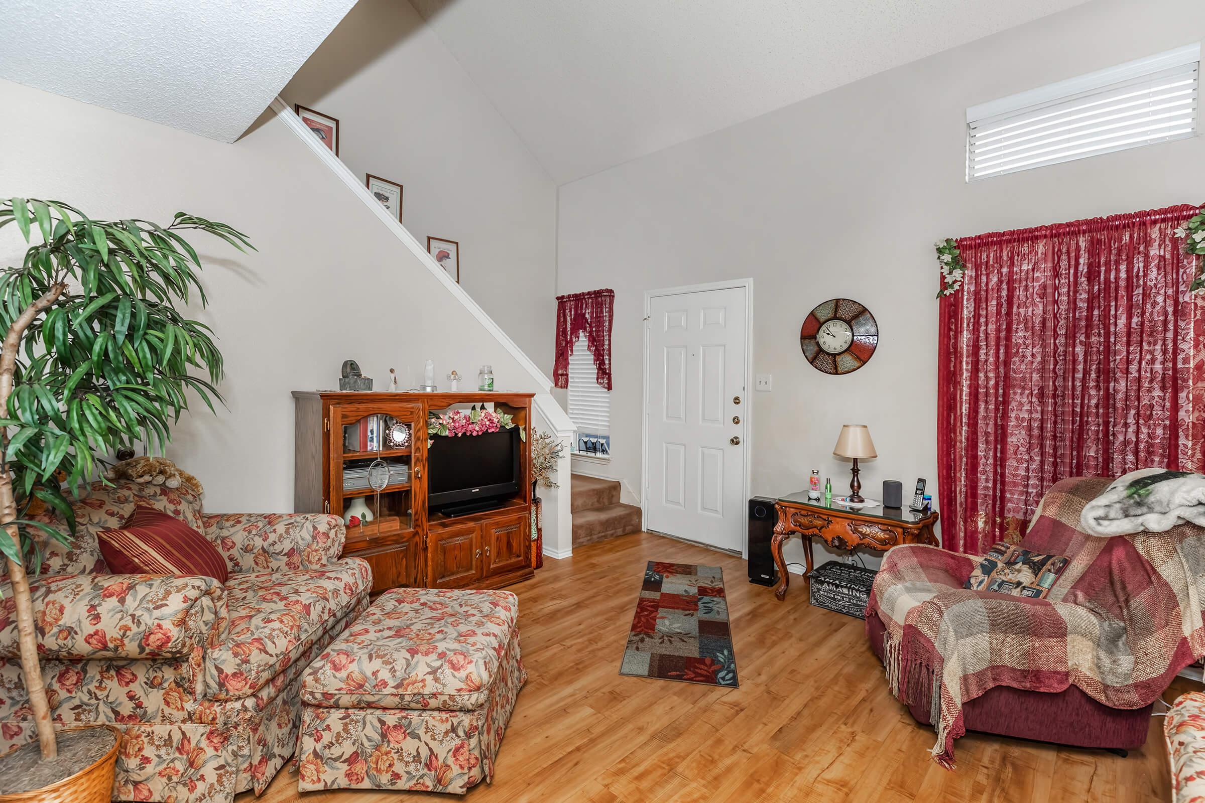 a living room filled with furniture and a fire place