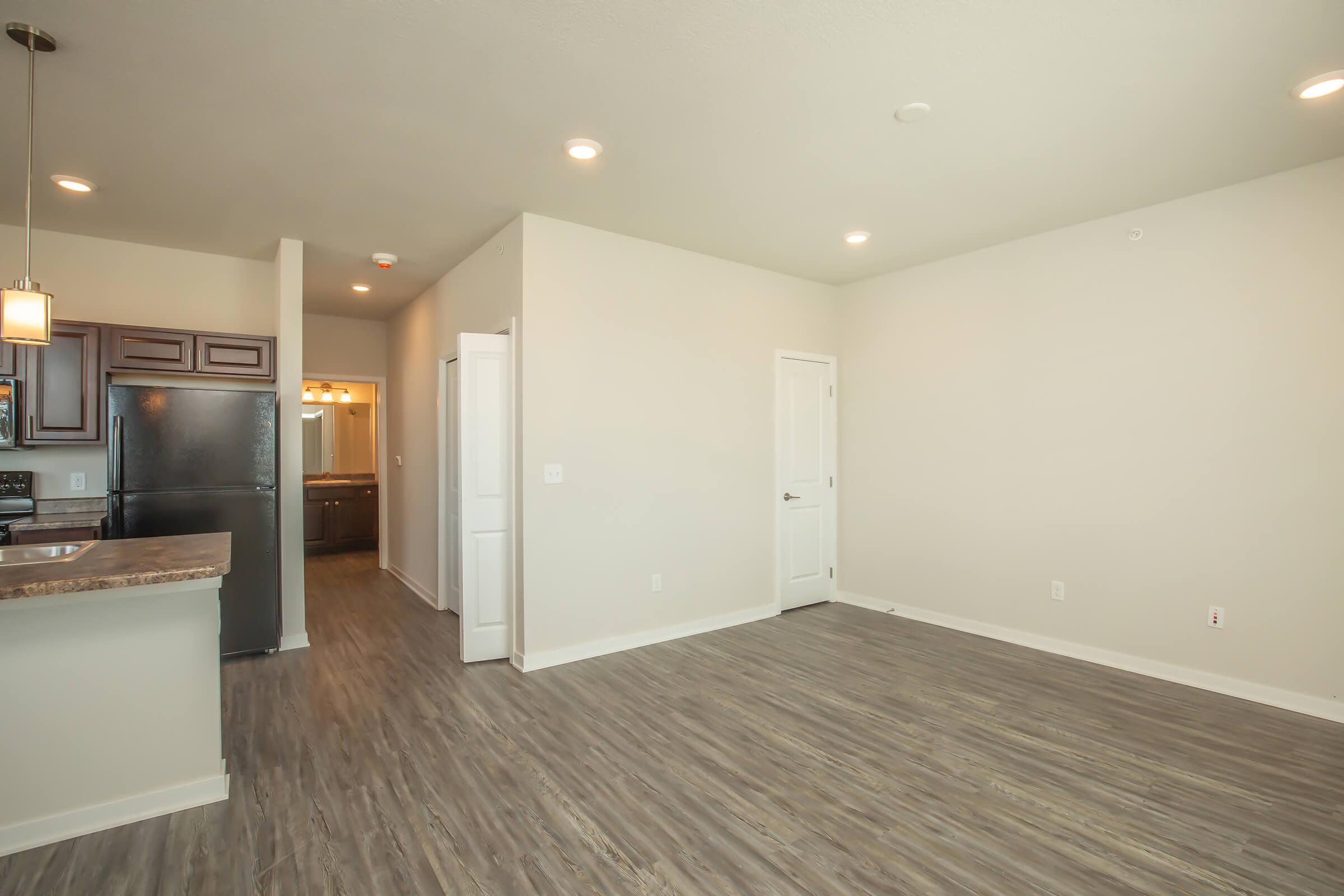 a kitchen with a wood floor